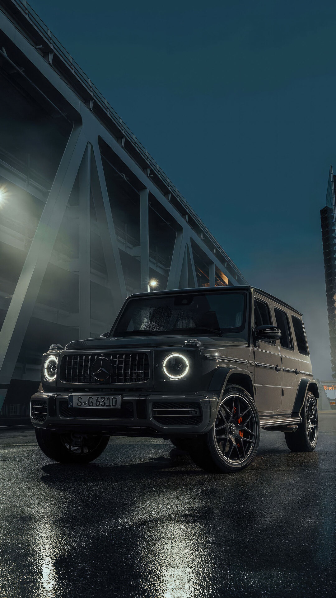 Mercedes-AMG G 63 4x4 parked on wet street HD Phone Wallpaper