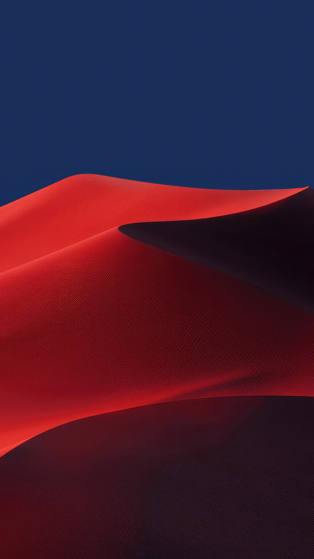 Red sand dunes against a dark blue sky HD Phone Wallpaper