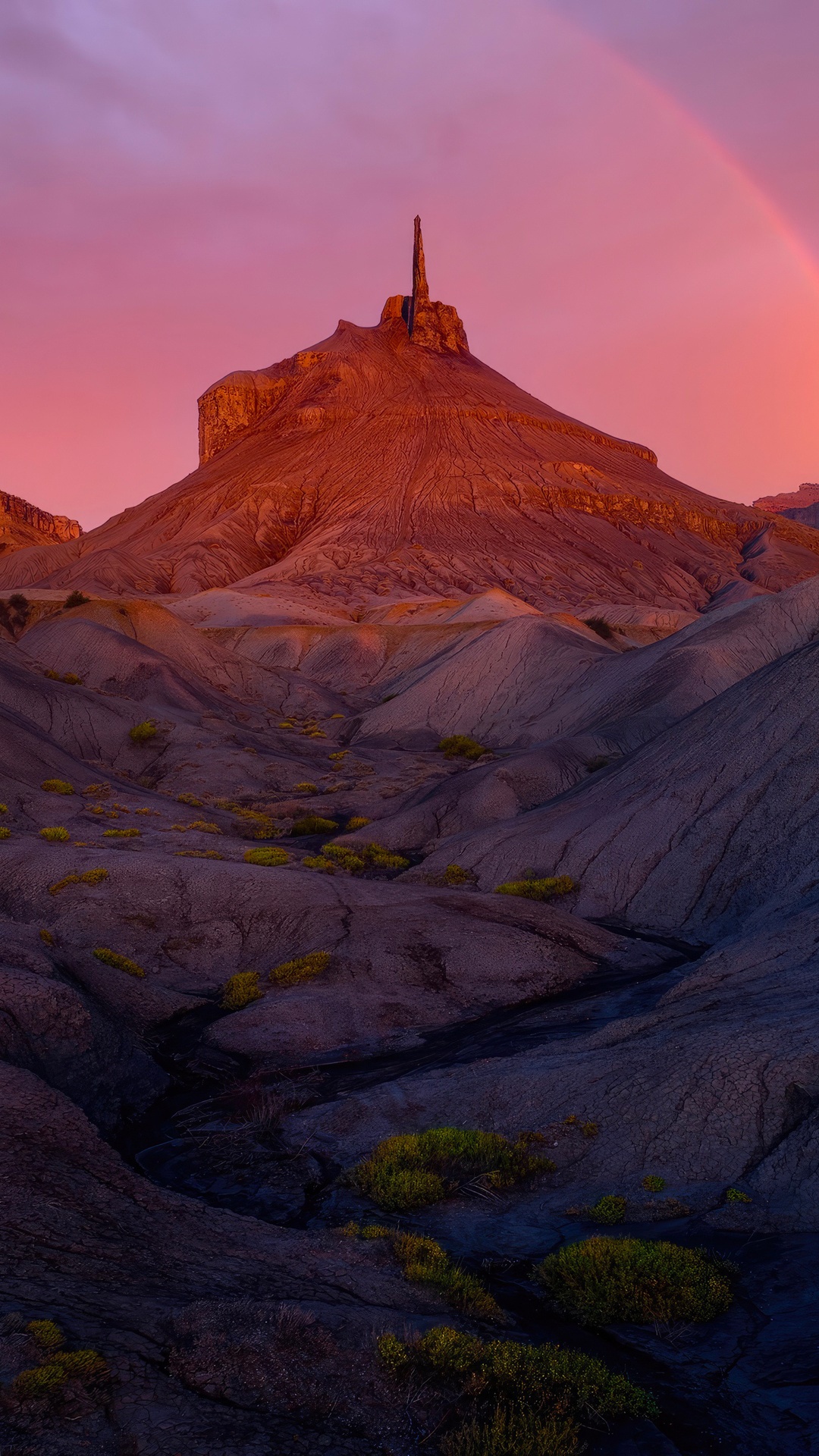 Desert landscape with rock formations and rainbow at sunset HD Phone Wallpaper