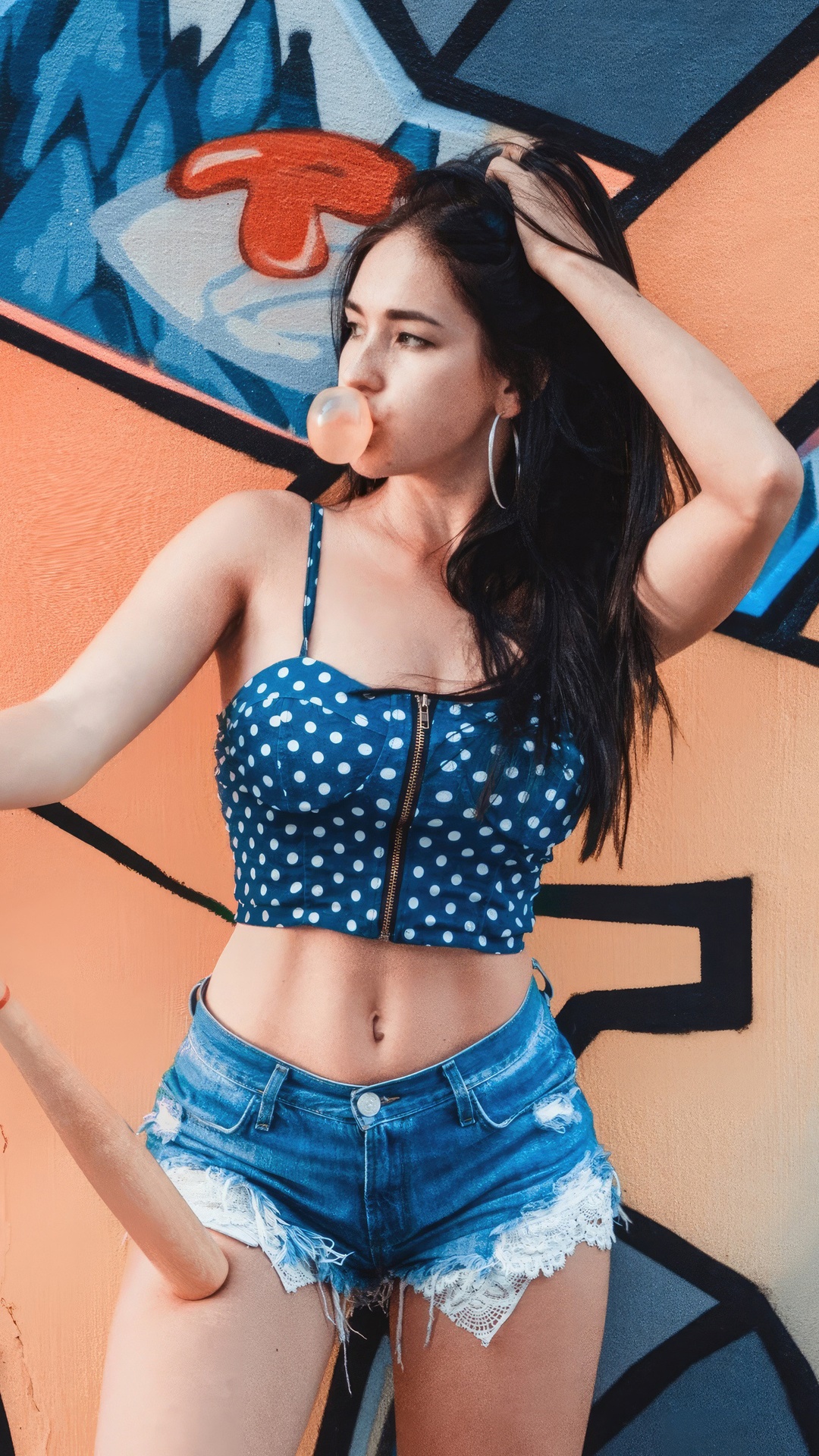 Model blowing bubblegum in front of graffiti HD Phone Wallpaper