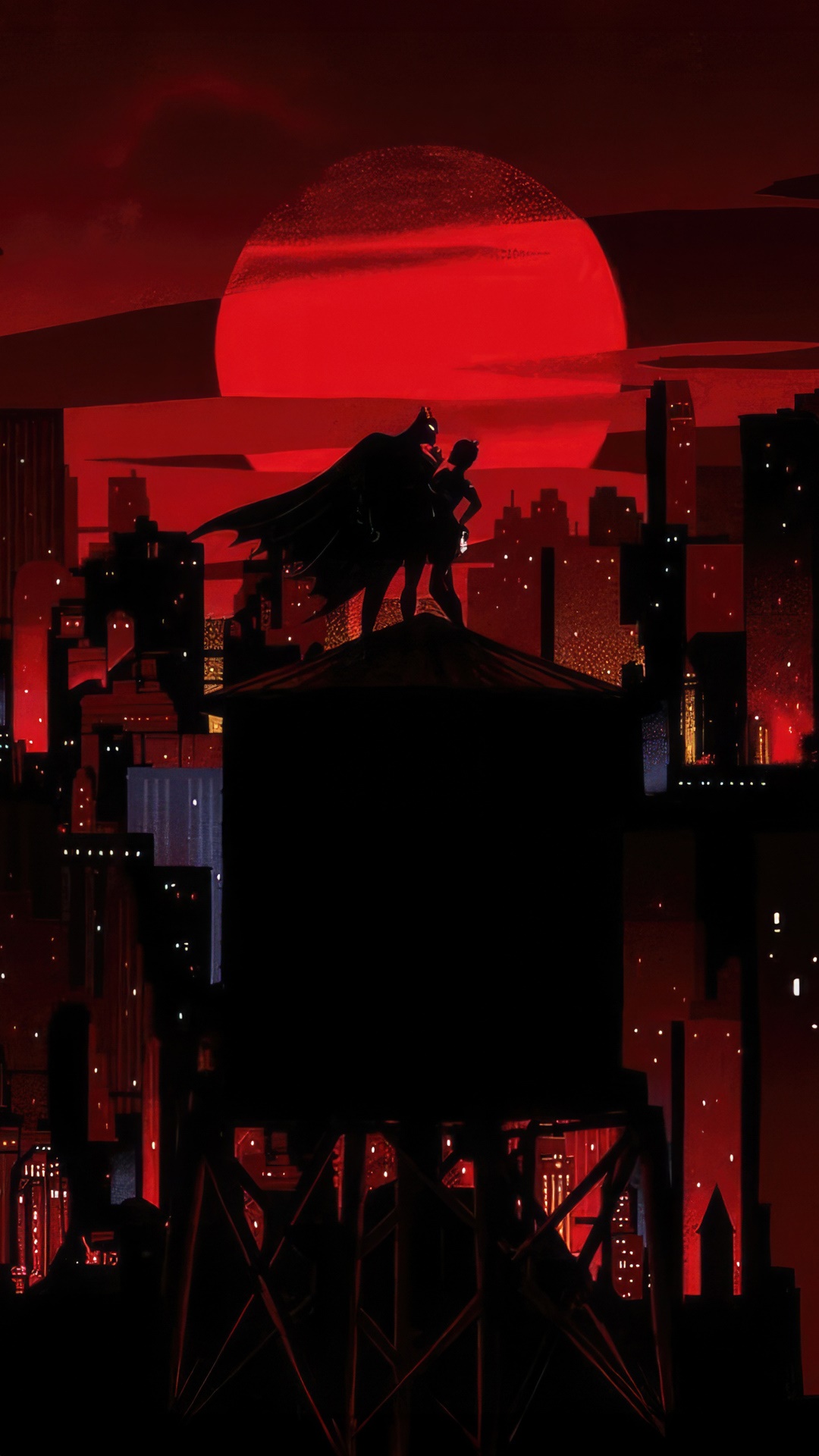 Batman and Catwoman on a rooftop at sunset HD Phone Wallpaper