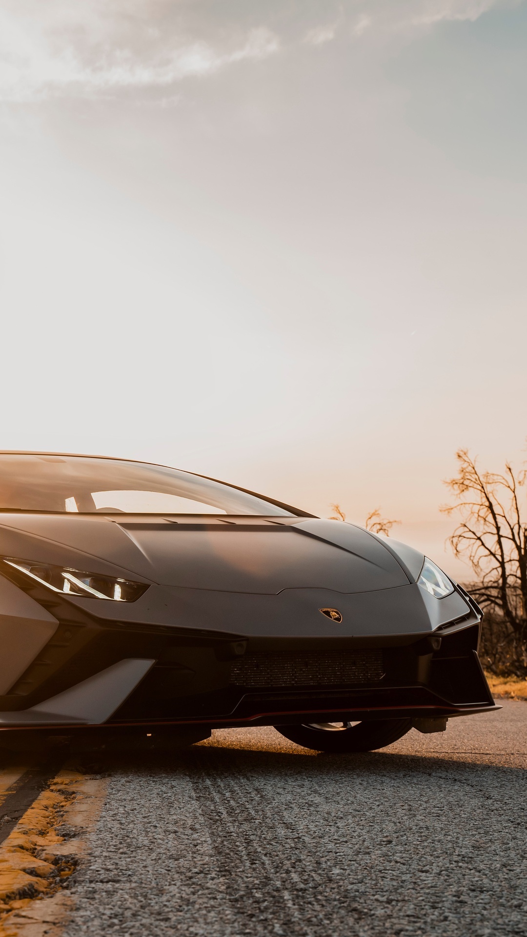 Lamborghini Huracan parked on a road at sunset HD Phone Wallpaper