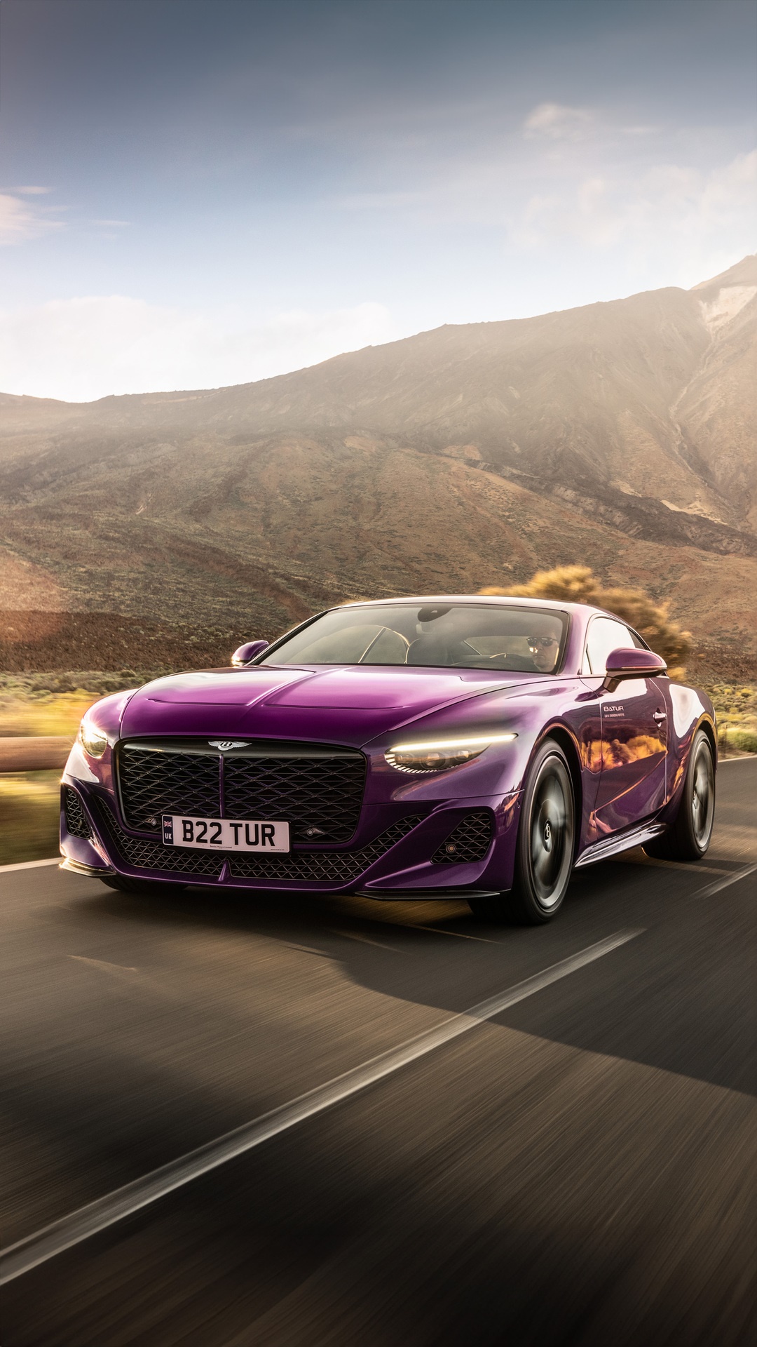 Purple Bentley Batur driving on a mountain road HD Phone Wallpaper