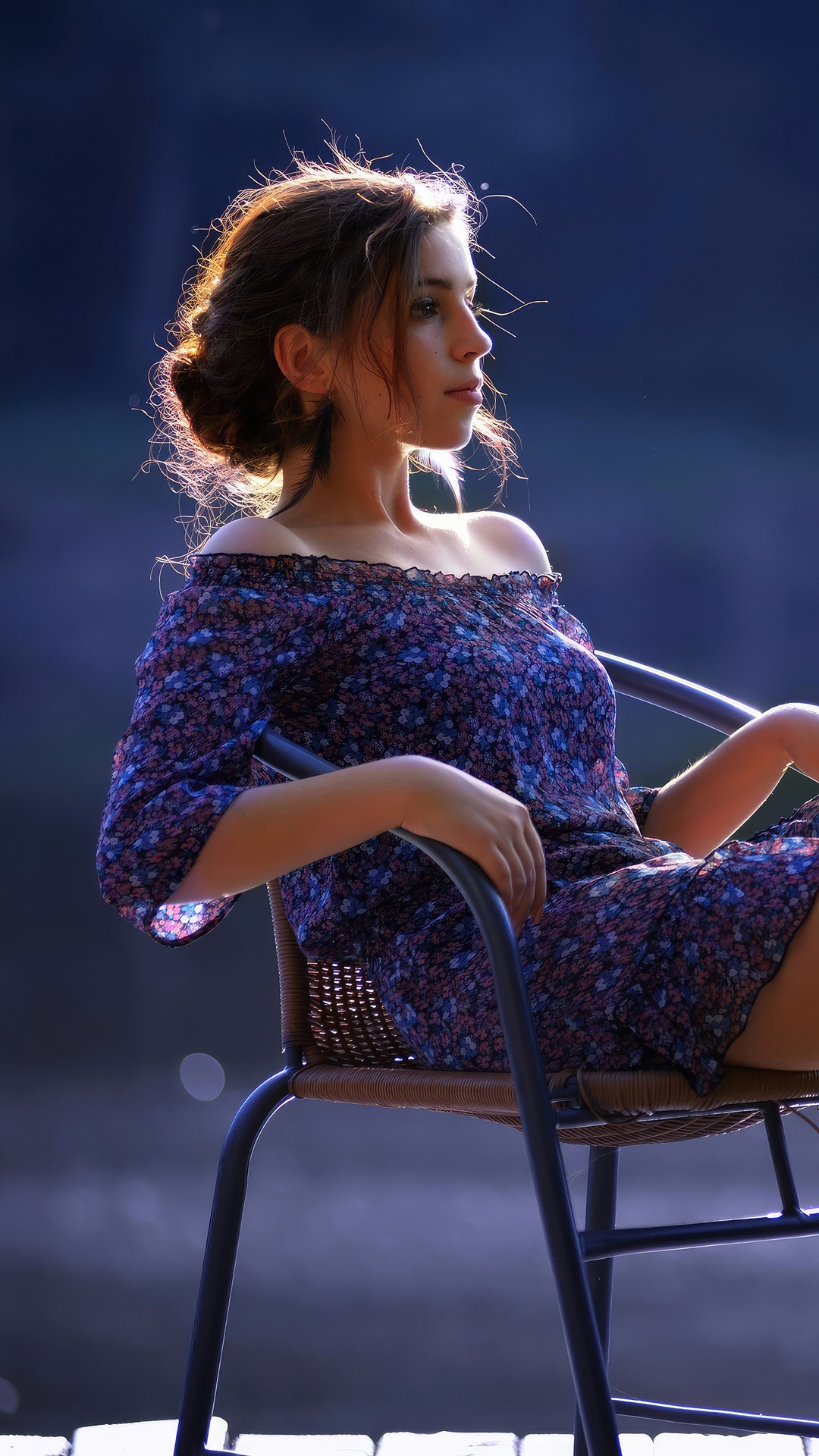 Young woman in a floral dress sitting on a chair HD Phone Wallpaper