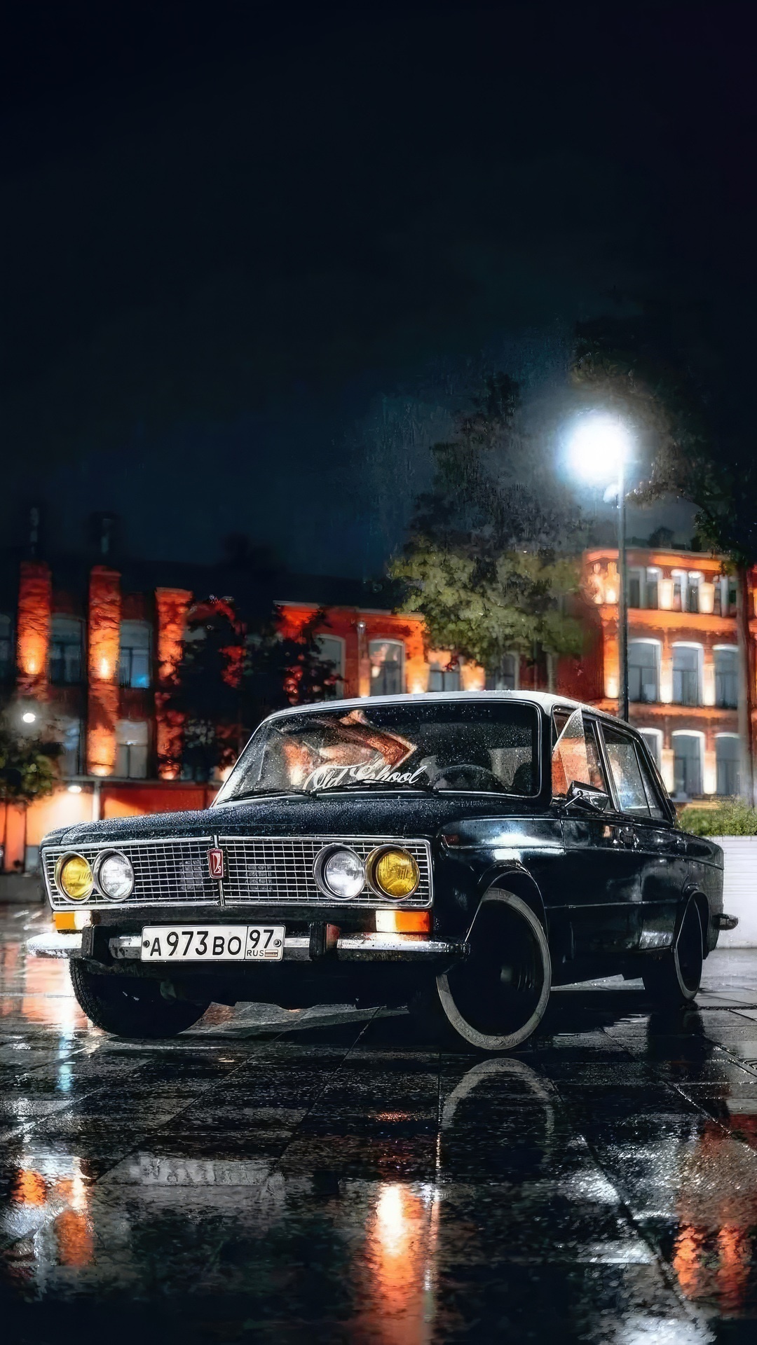 Black classic car on a wet street at night HD Phone Wallpaper