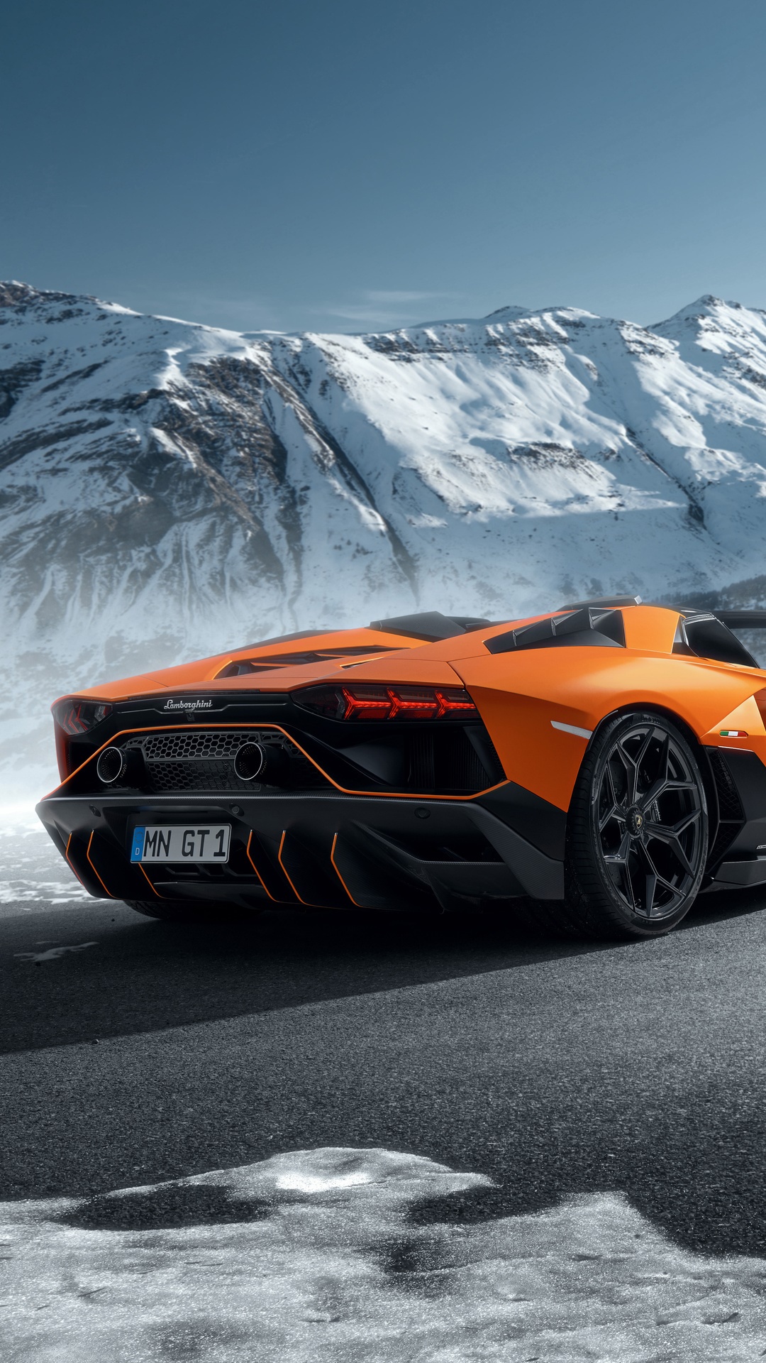 Orange Lamborghini Aventador in Snowy Mountains HD Phone Wallpaper