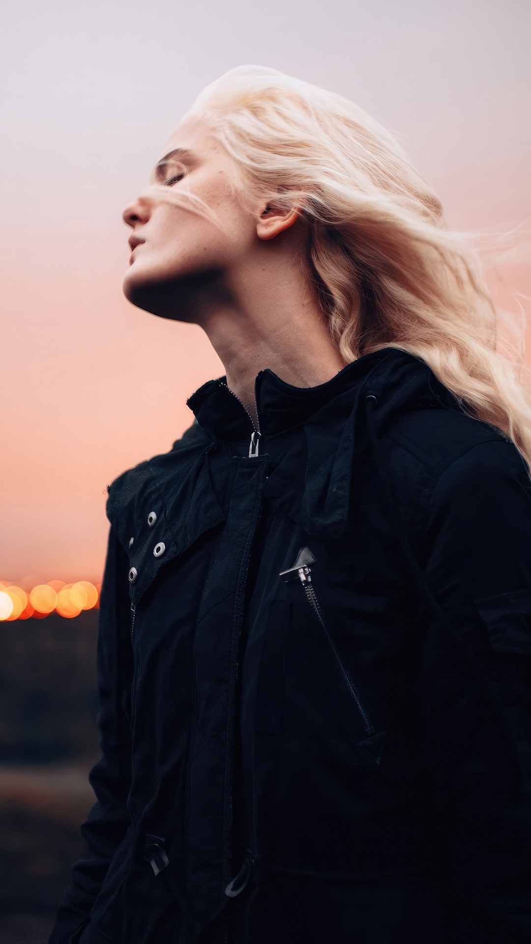Woman with blonde hair wearing a black jacket HD Phone Wallpaper