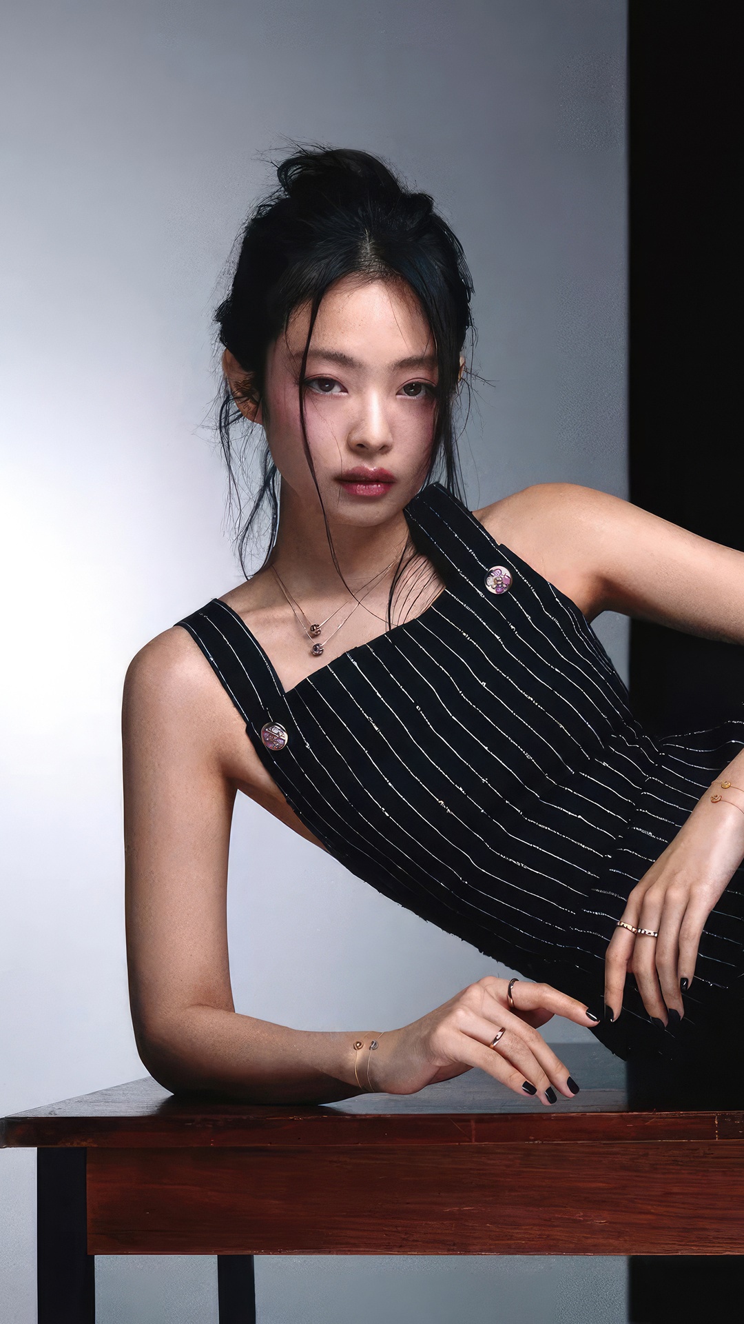 Jennie Kim in a black pinstripe outfit HD Phone Wallpaper