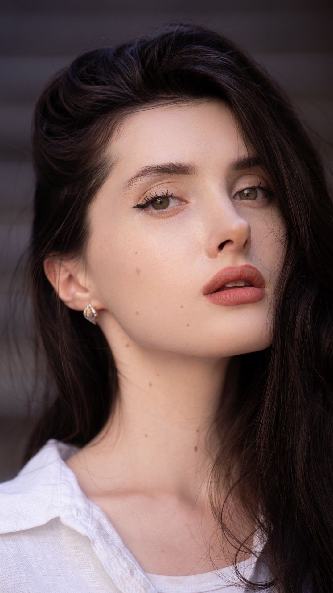 Young woman with dark hair and makeup HD Phone Wallpaper