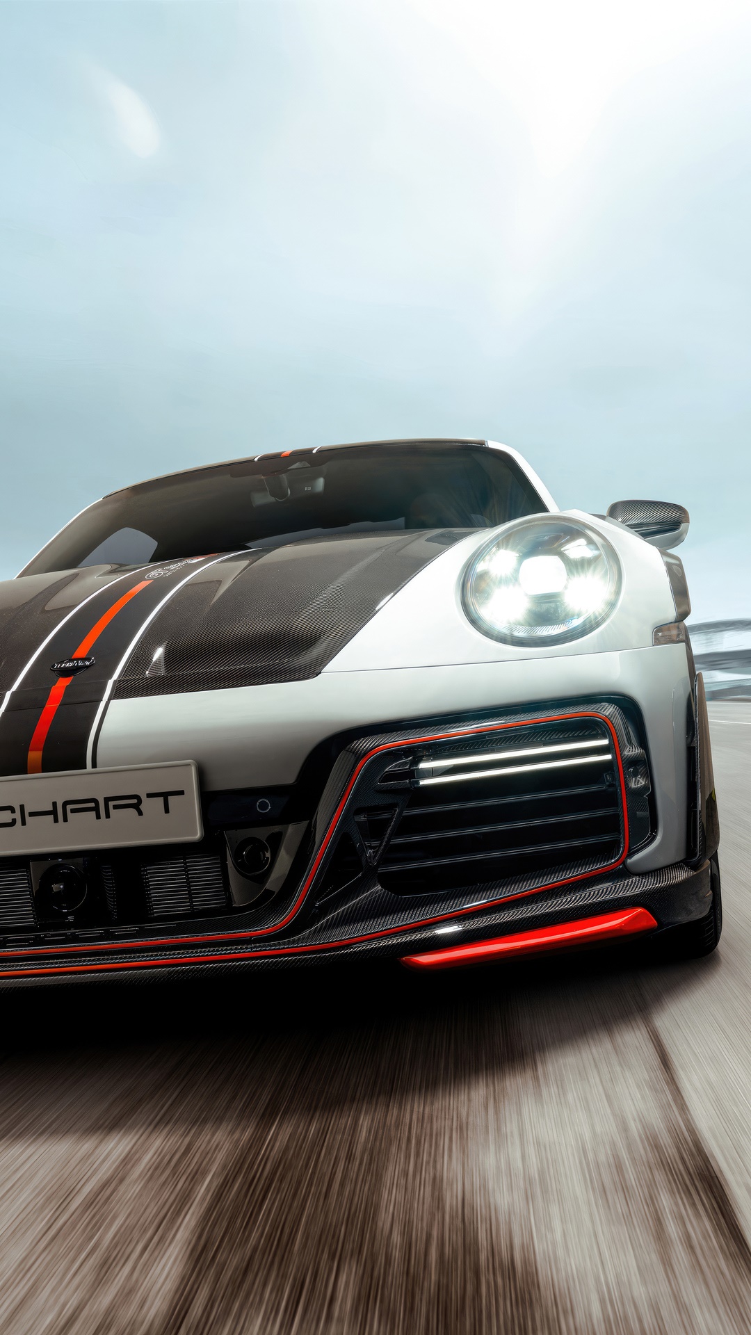 Porsche 992 with racing stripes on the road HD Phone Wallpaper