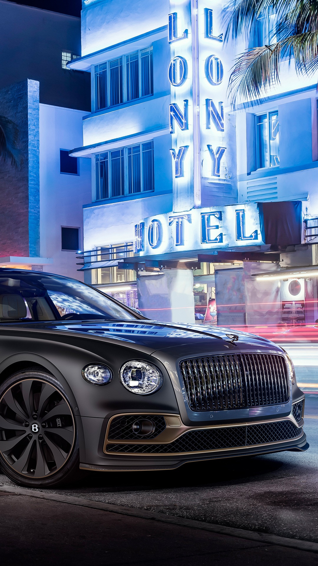 Bentley Flying Spur parked in front of a hotel at night HD Phone Wallpaper