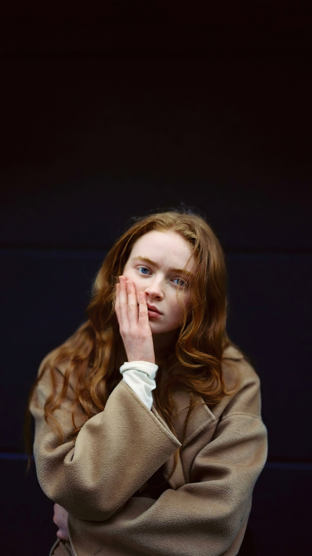 Sadie Sink with hand on face HD Phone Wallpaper