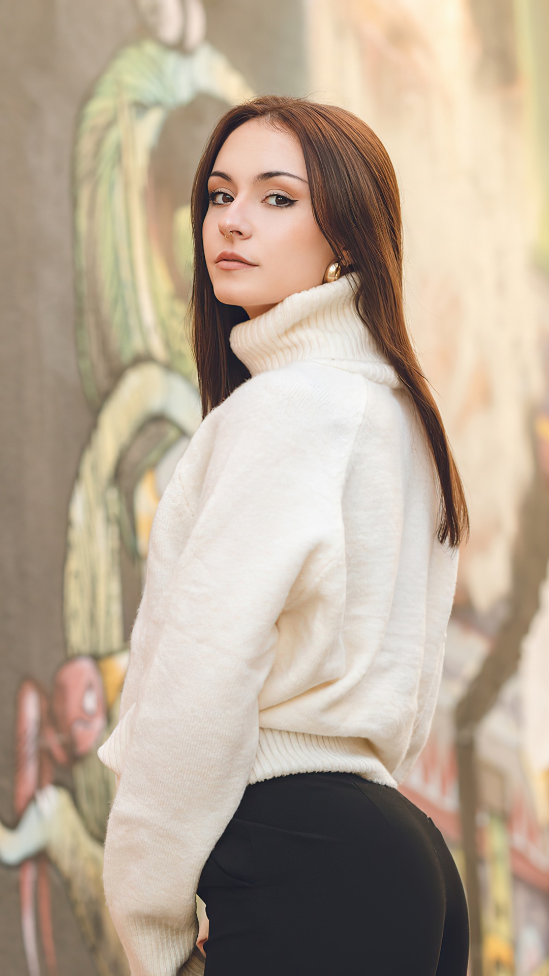 Young woman in a white turtleneck and black pants HD Phone Wallpaper