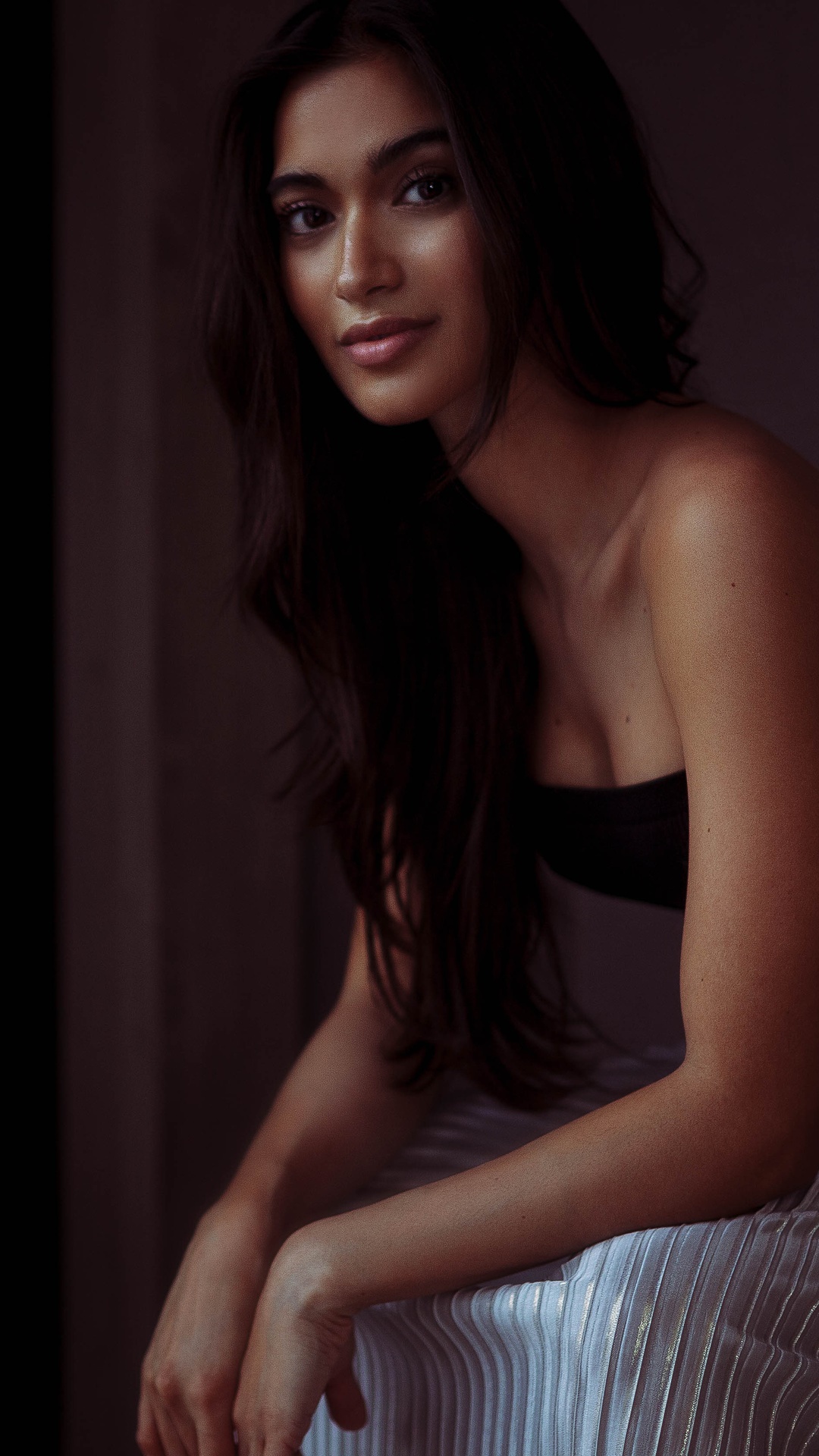 Model with long dark hair and a black top HD Phone Wallpaper