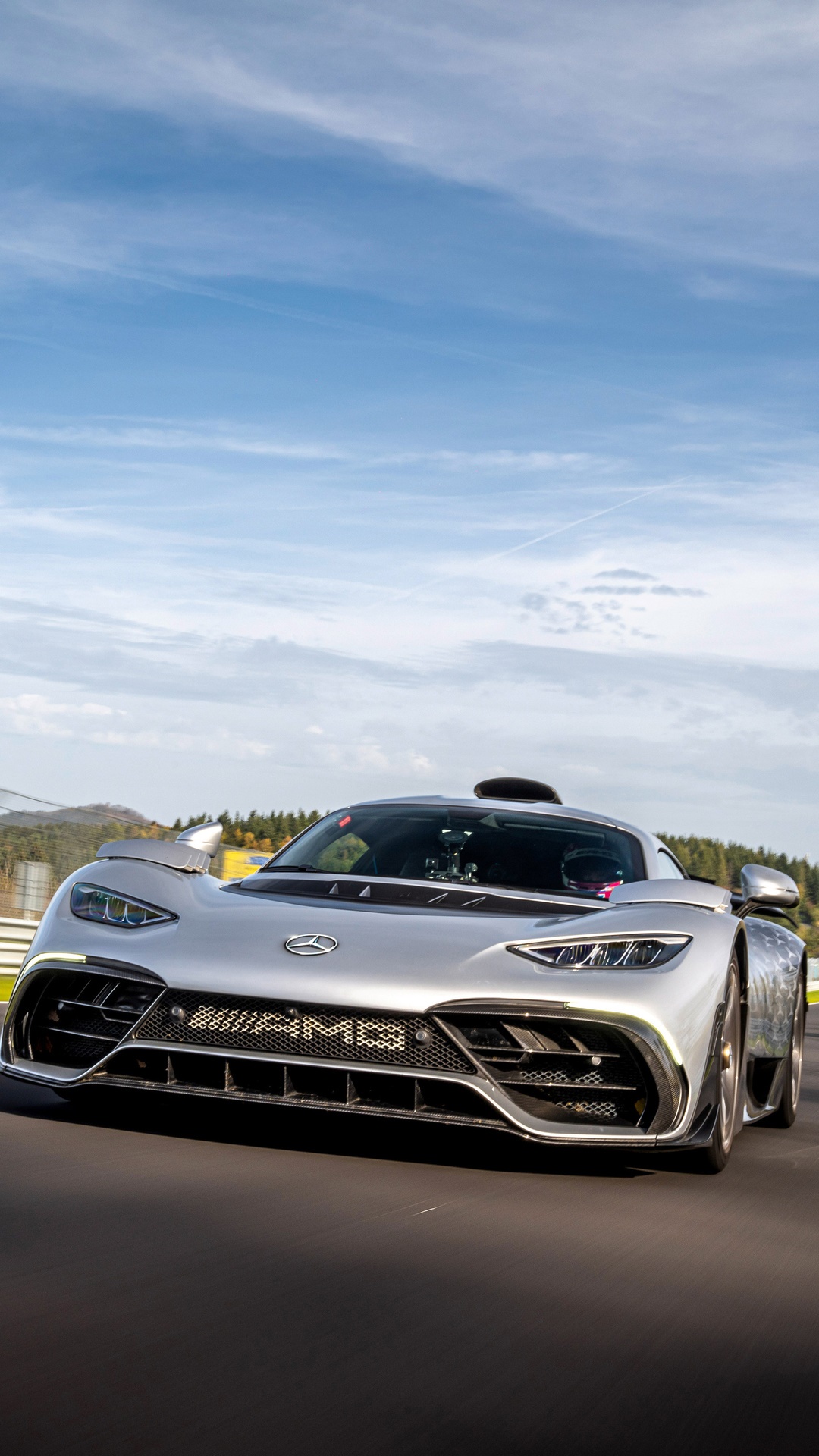 Silver Mercedes-AMG ONE driving on a track HD Phone Wallpaper