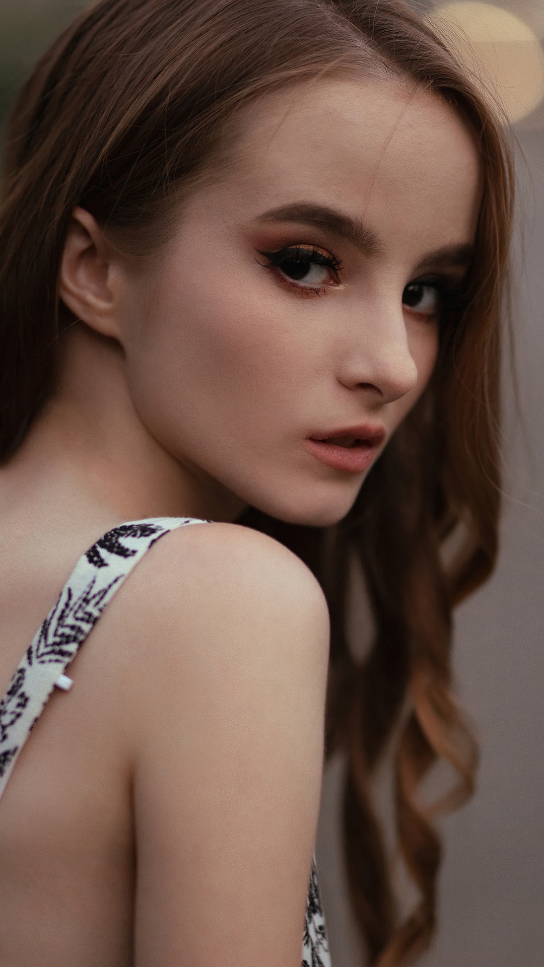 Young woman with brown hair and makeup HD Phone Wallpaper