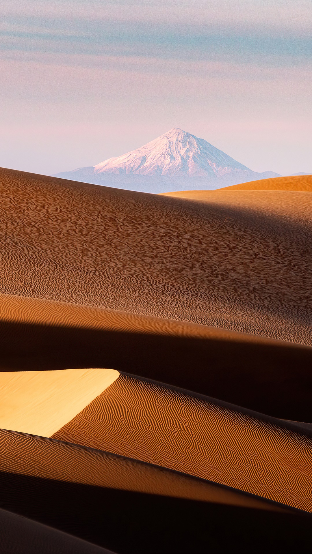 Snow-capped mountain over desert dunes HD Phone Wallpaper