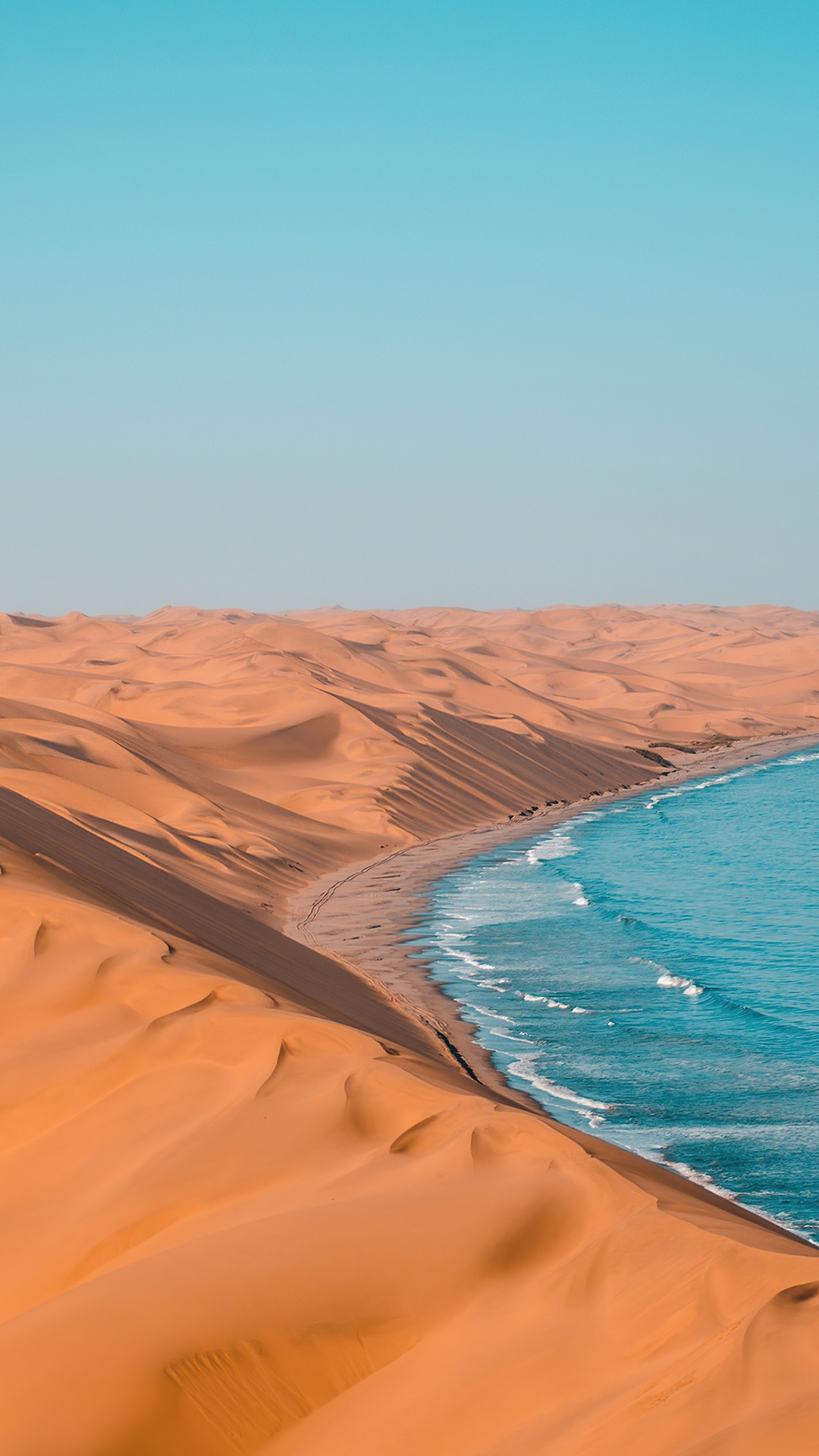 Desert sand dunes meet the ocean HD Phone Wallpaper