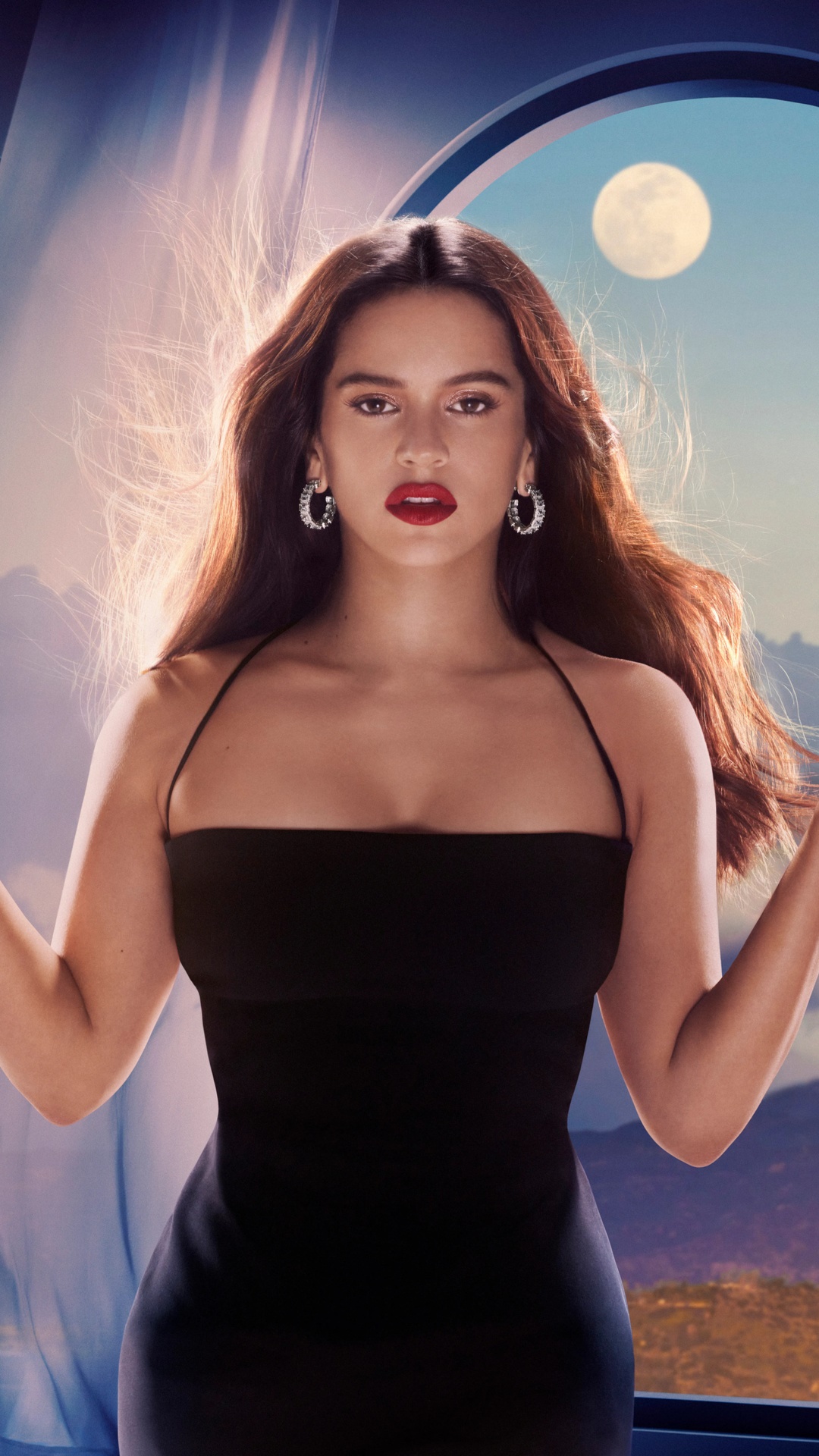 Rosalía in a black dress with a moon in the background HD Phone Wallpaper