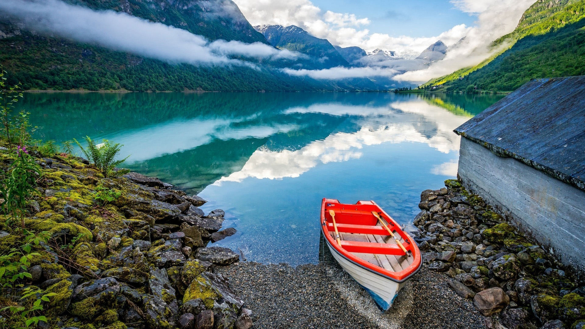 Red boat on a lake with mountains and clouds HD Wallpaper