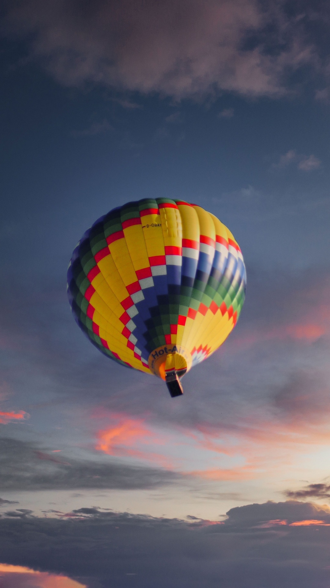 Hot air balloon flying in the sky at sunset HD Phone Wallpaper