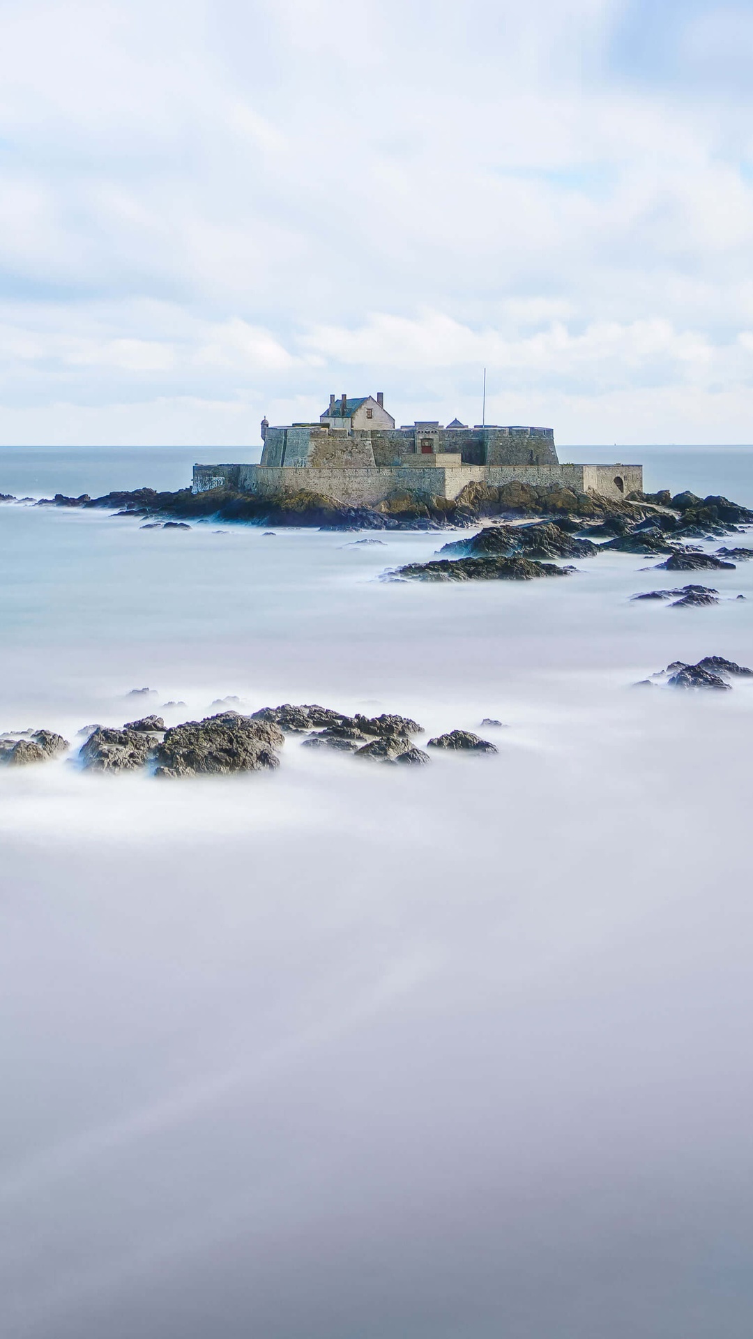 Fortress on rocks in the ocean HD Phone Wallpaper