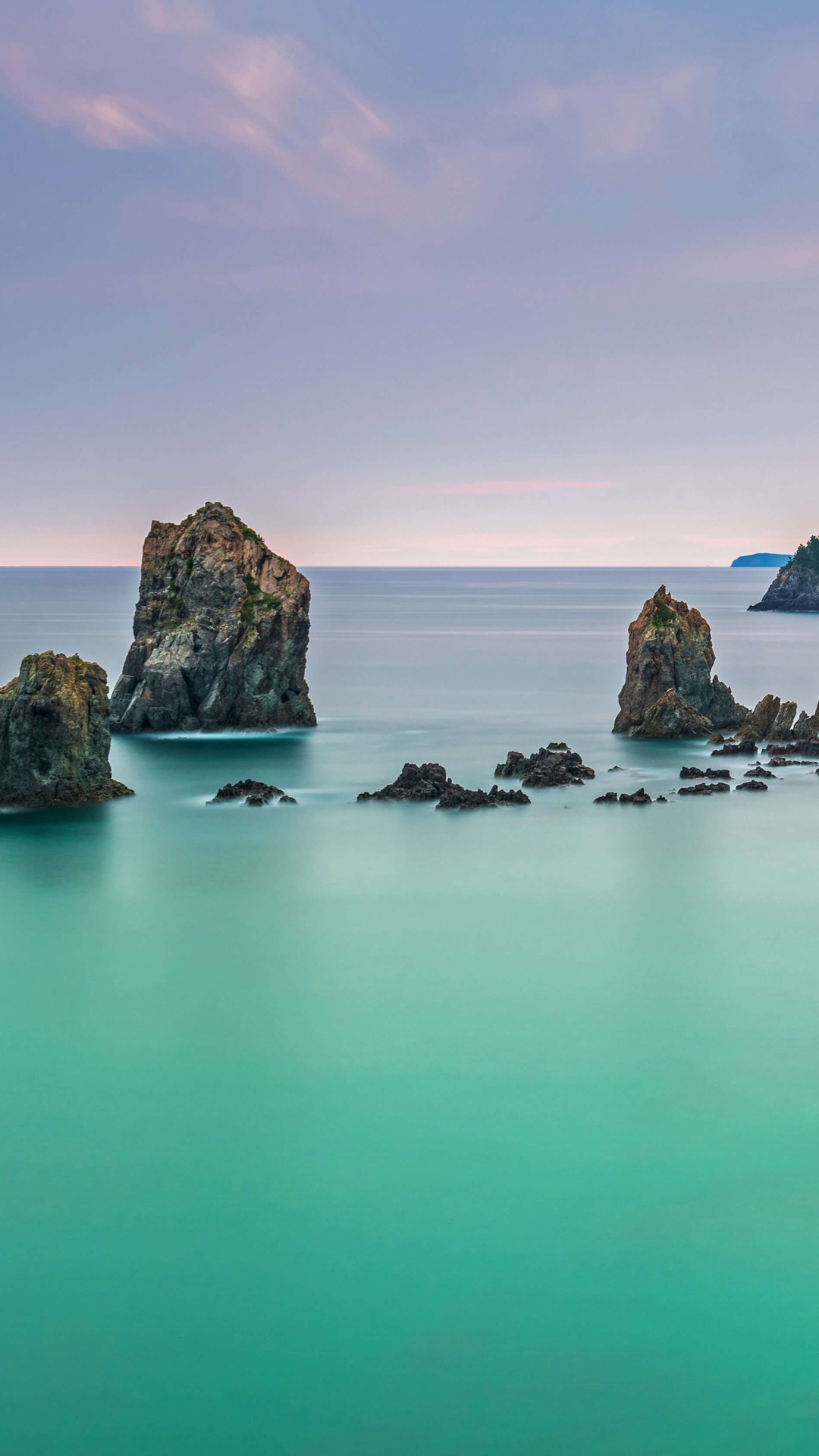 Rocky islands in the ocean at sunset HD Phone Wallpaper