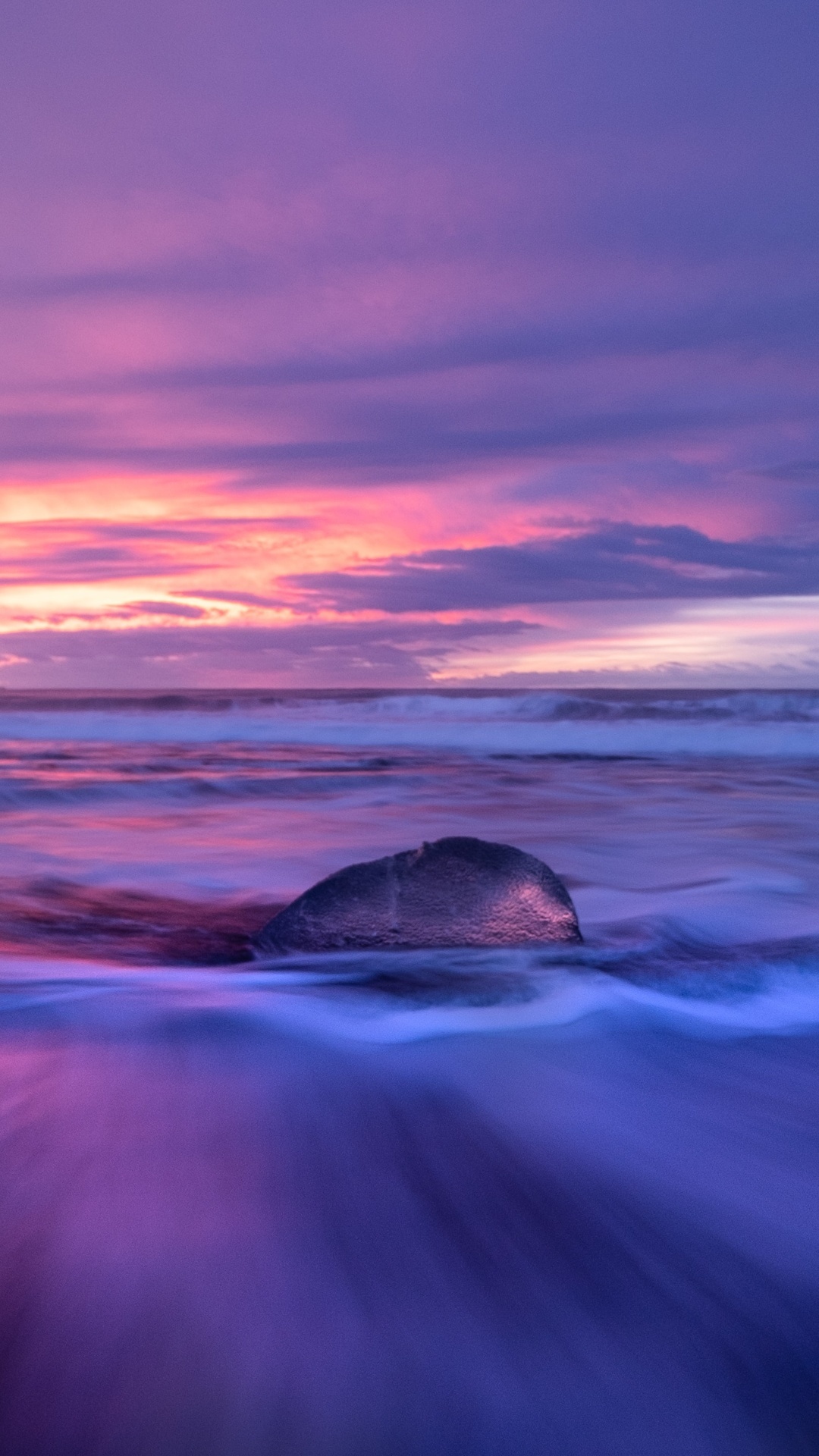 Iceberg on a beach during sunset HD Phone Wallpaper