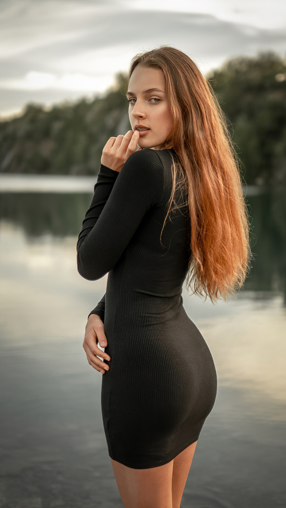 Redhead girl in black dress by the water HD Phone Wallpaper