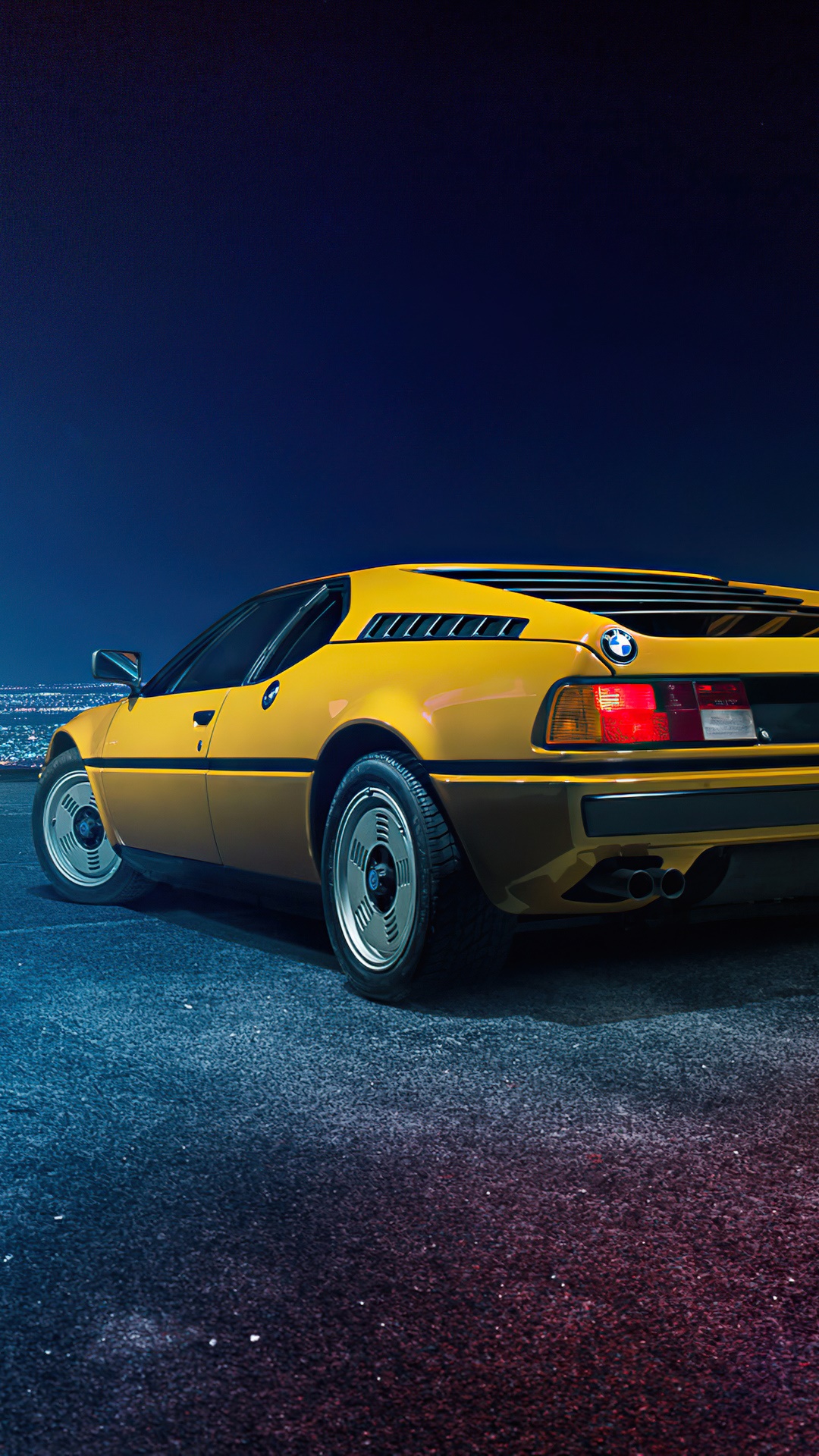 Yellow BMW M1 car at night HD Phone Wallpaper