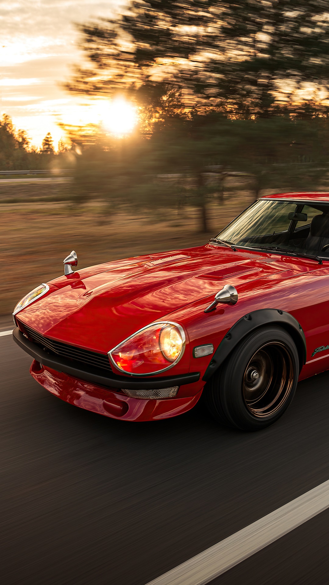 Red Datsun Fairlady Z driving at sunset HD Phone Wallpaper