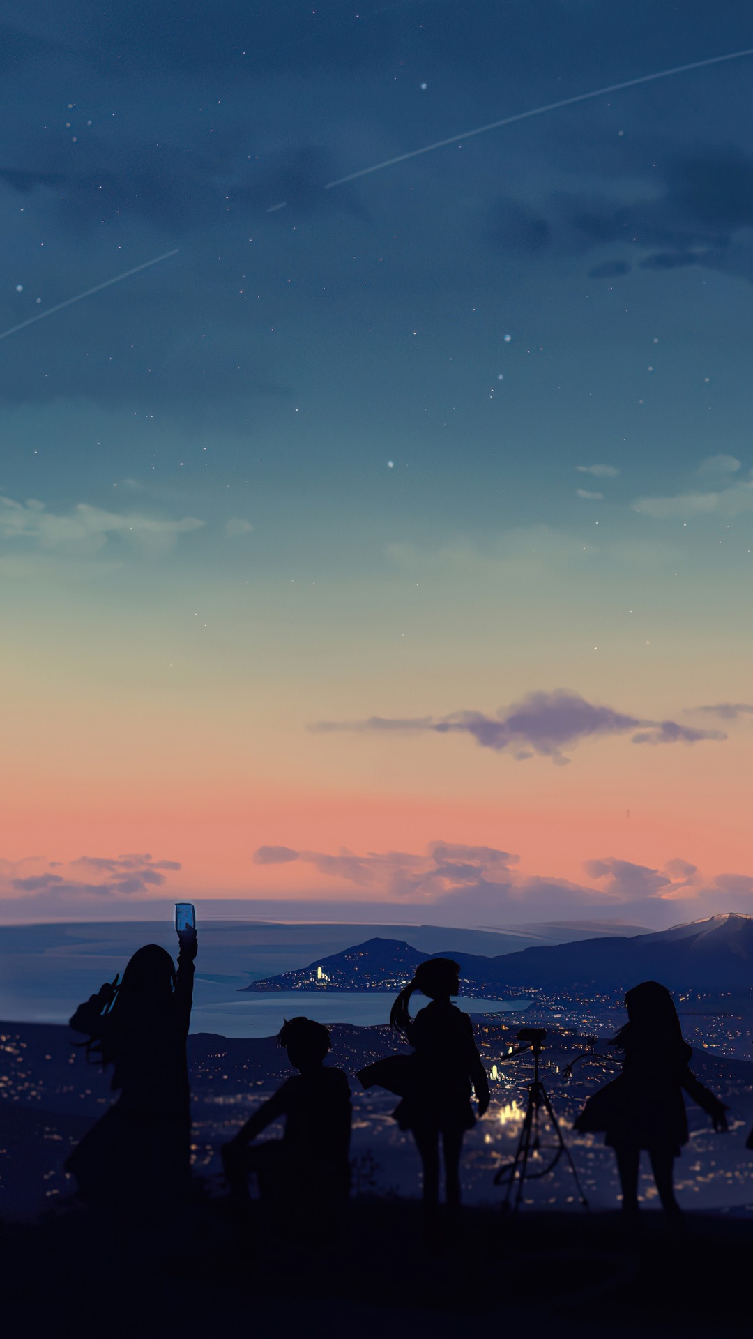 Four friends watch a city at dusk from a hilltop HD Phone Wallpaper