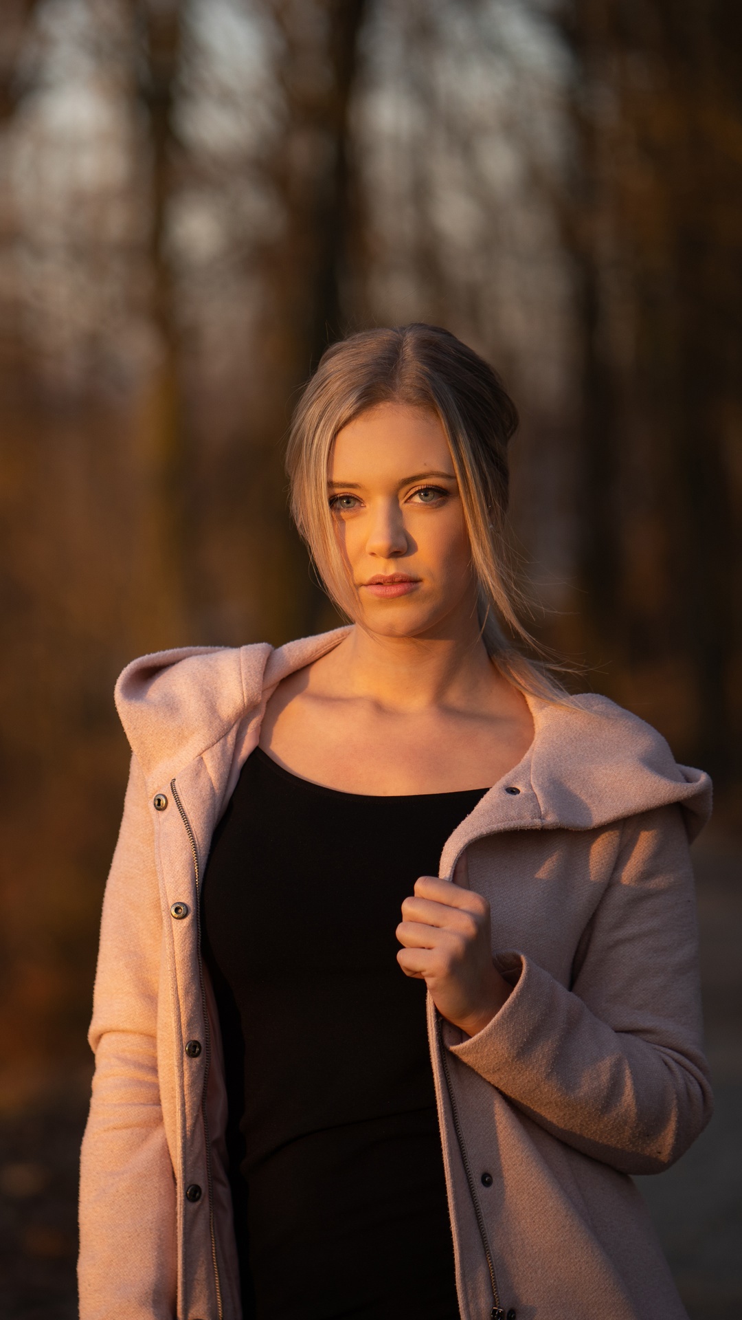 Young woman in a pink coat HD Phone Wallpaper