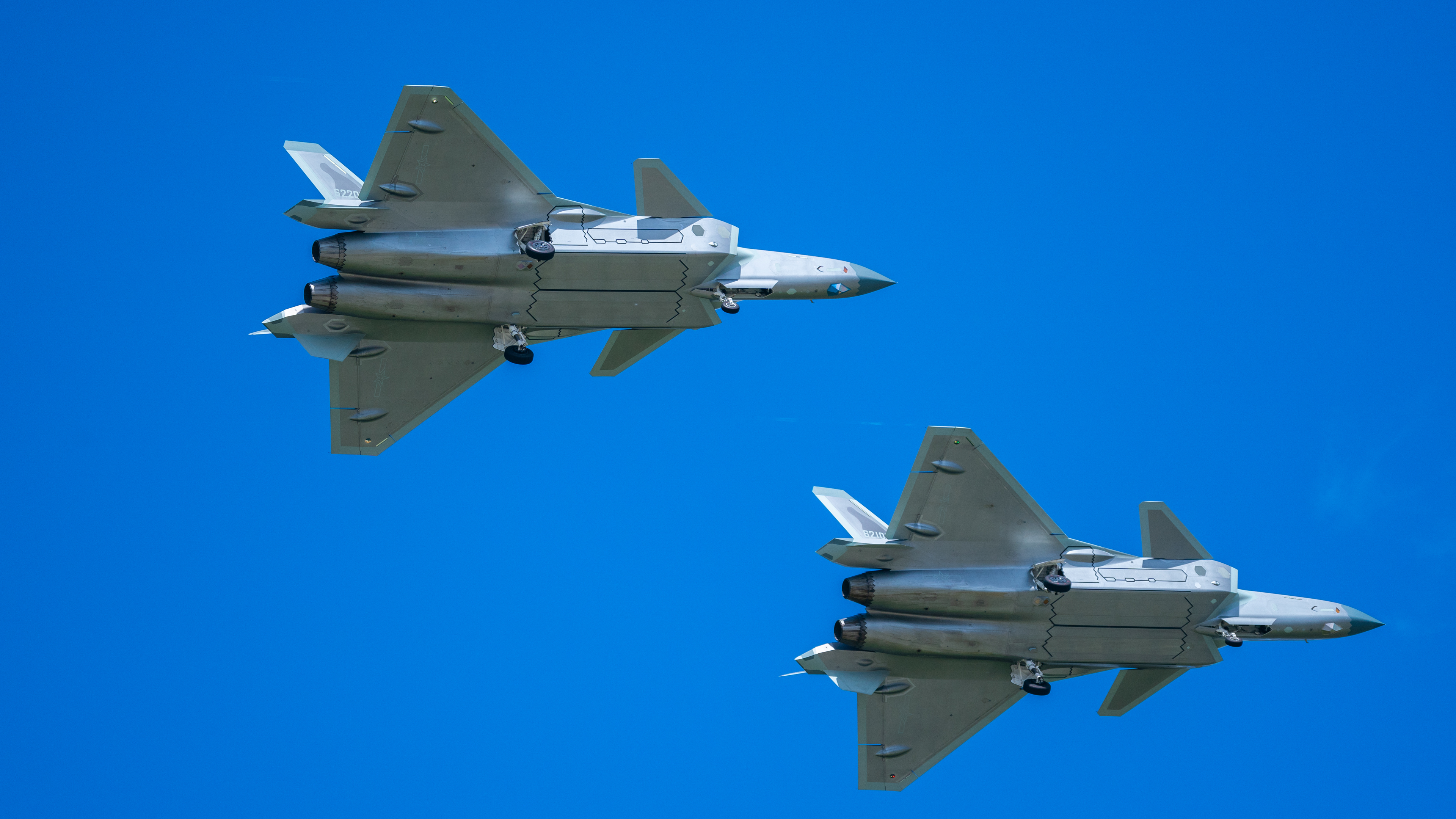 Two PLAAF J-20 fighter jets flying in the sky HD Wallpaper