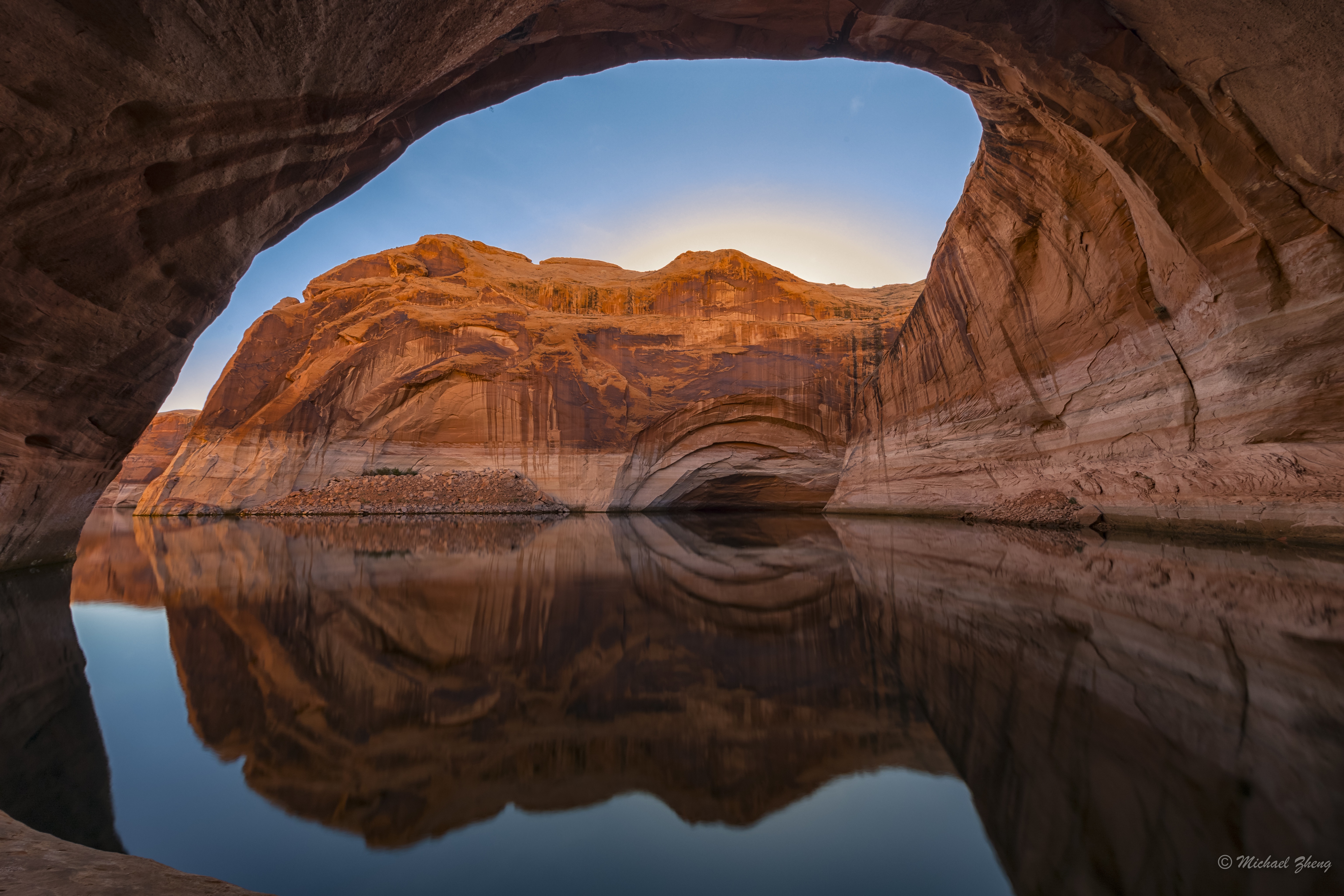 4K reflection of a sandstone arch over water HD Wallpaper