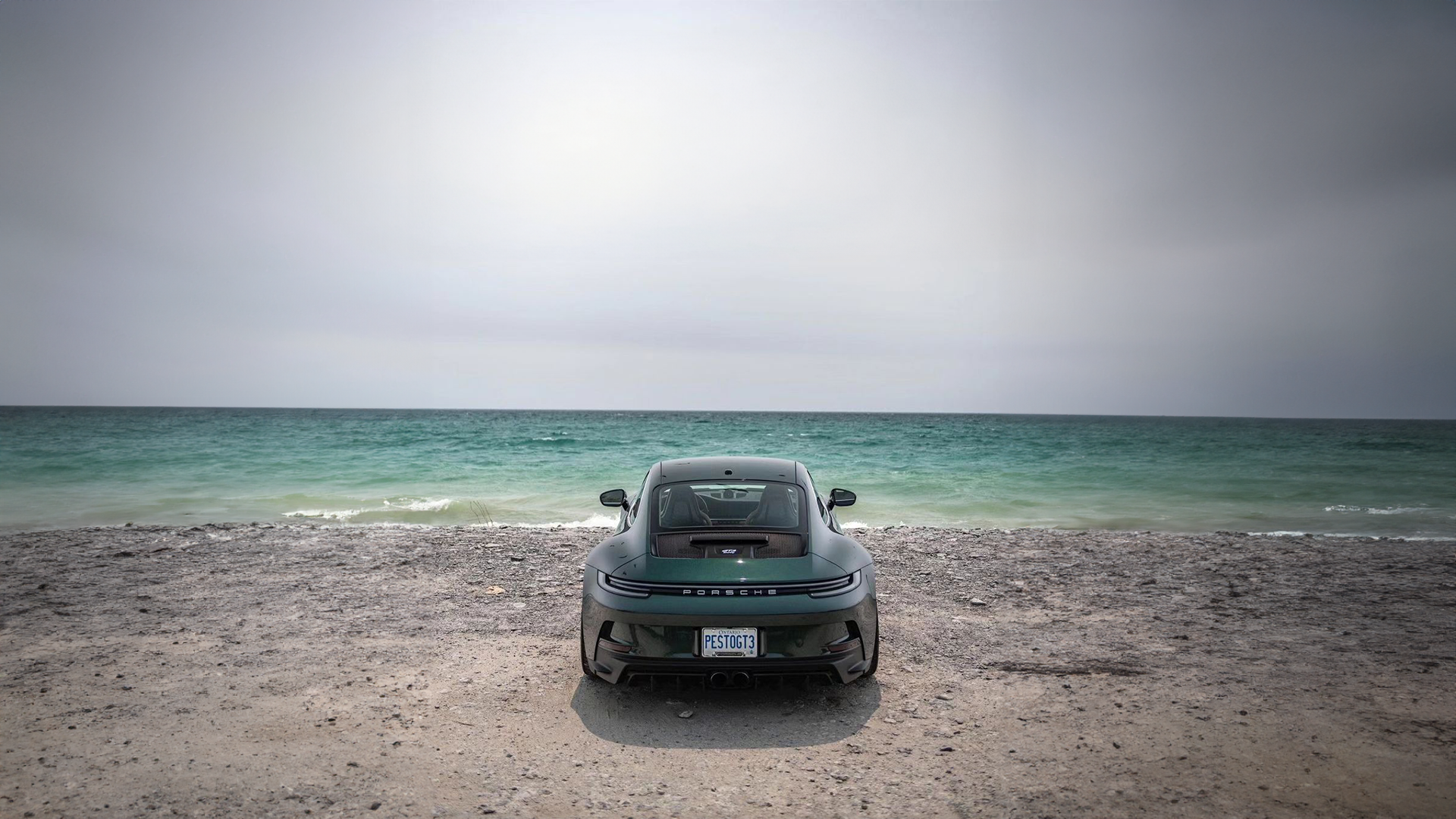 Porsche 911 GT3 parked on a beach by the sea HD Wallpaper