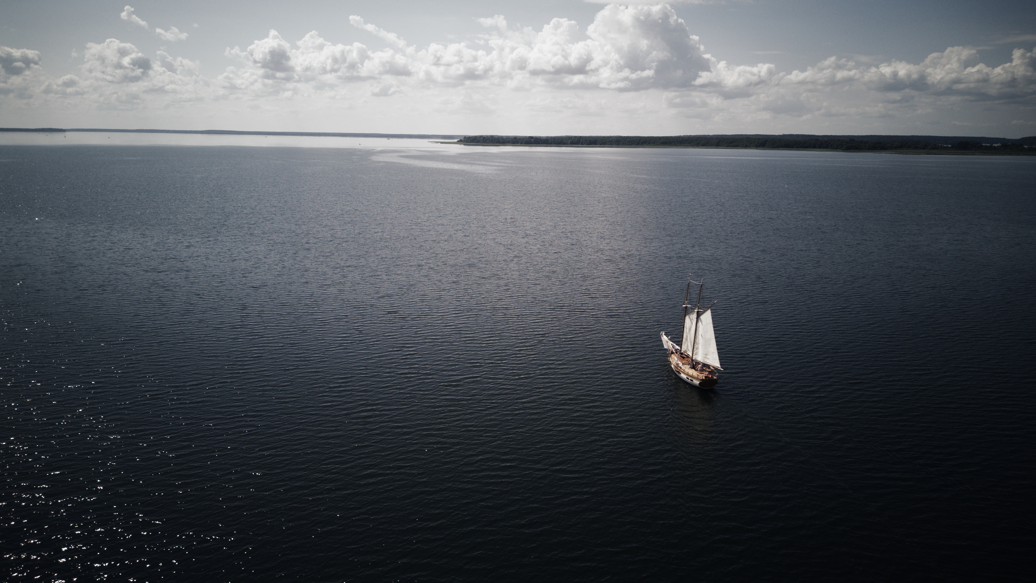 4K drone photo of a ship sailing on the sea HD Wallpaper
