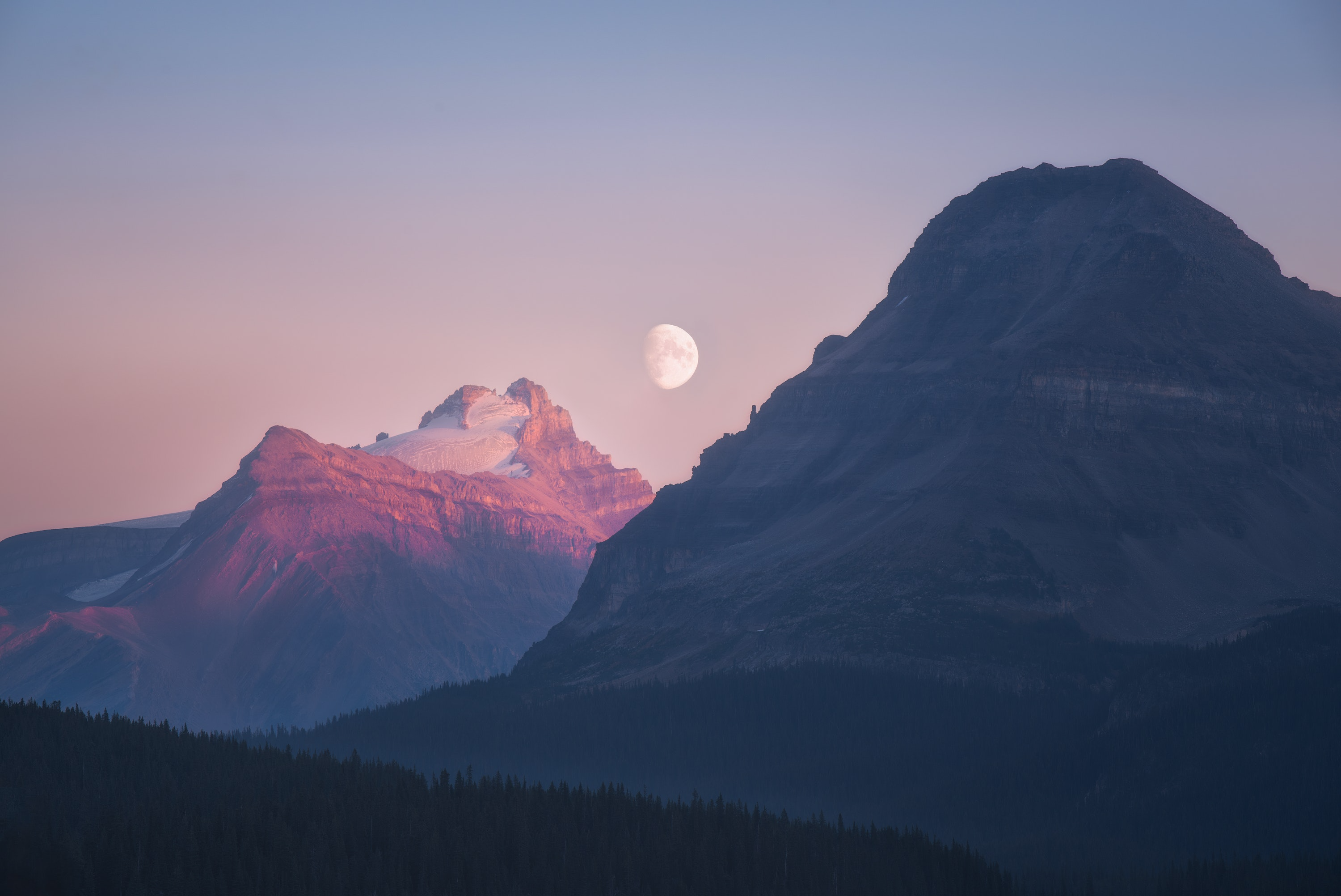Moon over mountains at sunrise with forest HD Wallpaper