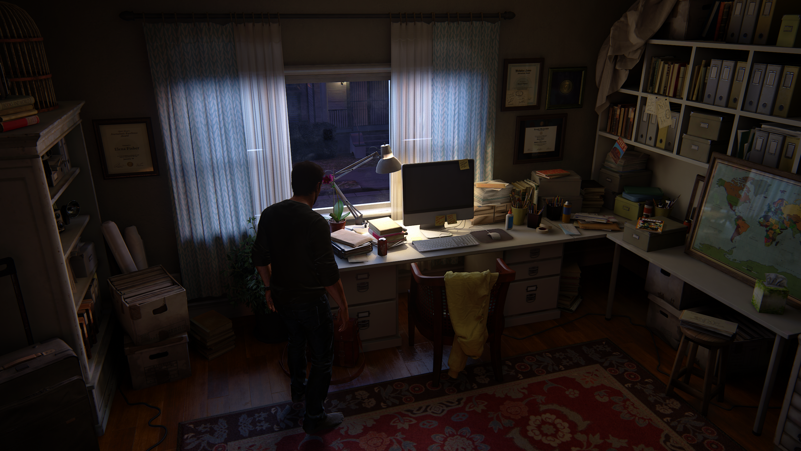 Nathan Drake's study with computer and maps HD Wallpaper