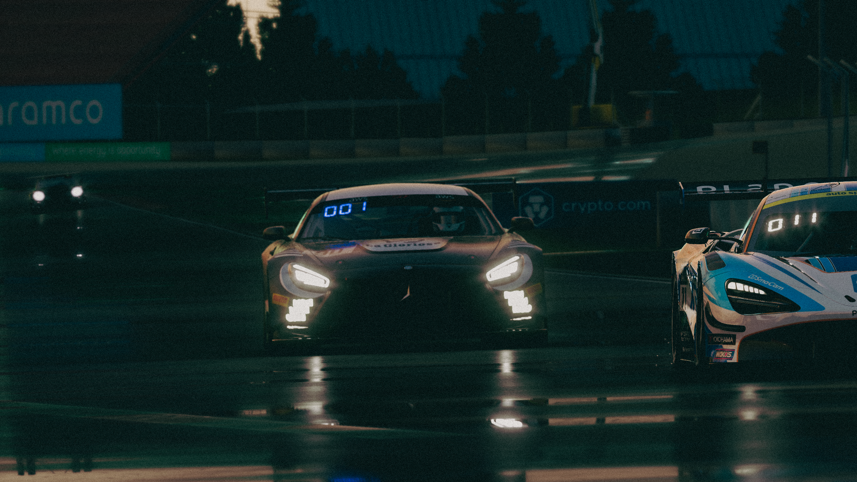 Assetto Corsa racing cars on a wet track at dusk HD Wallpaper