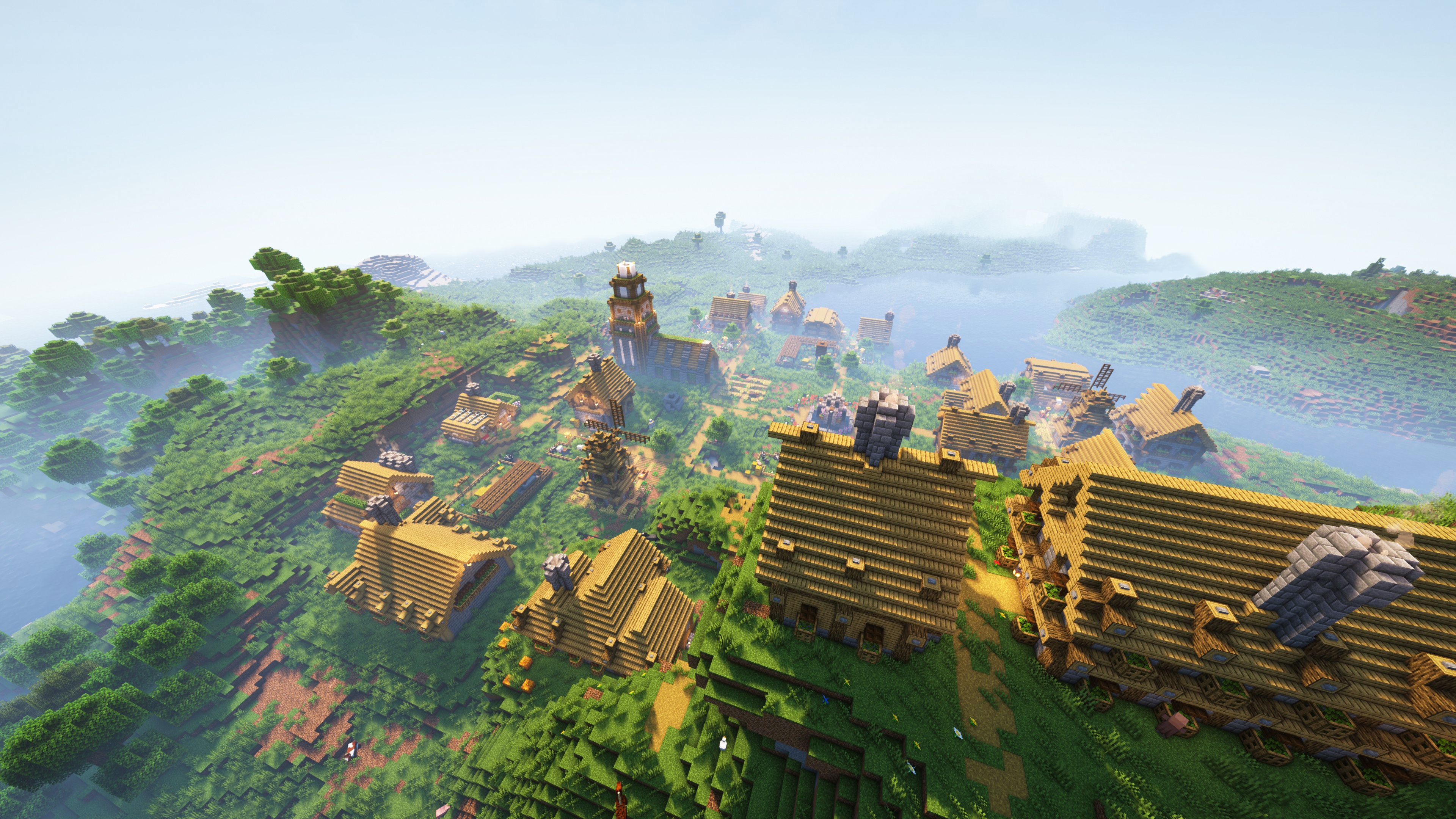 4K Minecraft Village Overlook with Misty Mountains HD Wallpaper