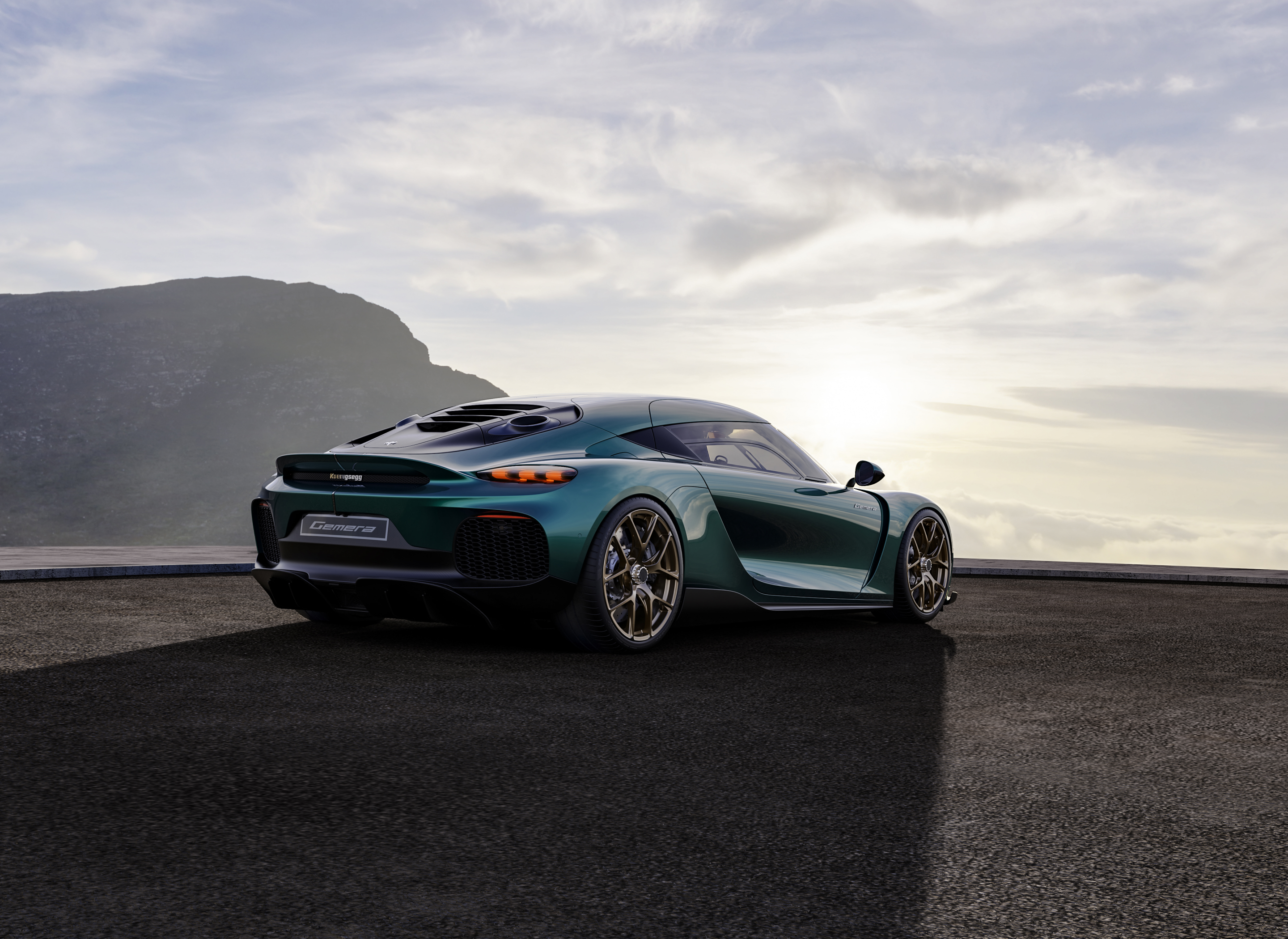 Koenigsegg Gemera rear view with mountains and sky HD Wallpaper