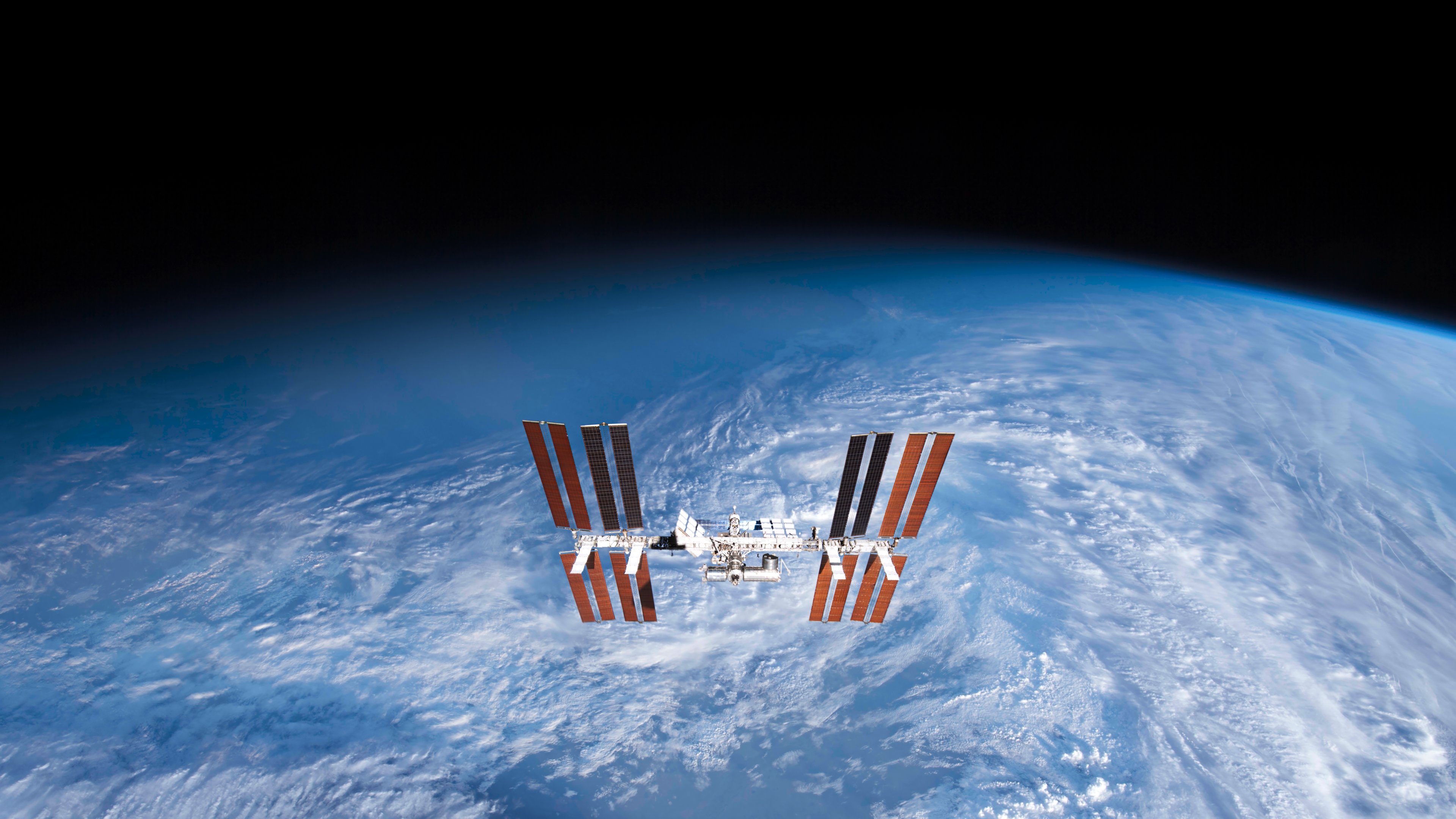 International Space Station orbiting Earth HD Wallpaper