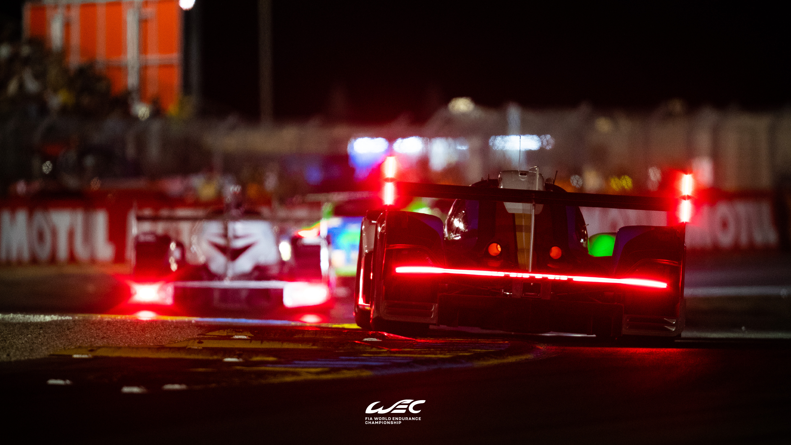 WEC race cars with red taillights at night HD Wallpaper