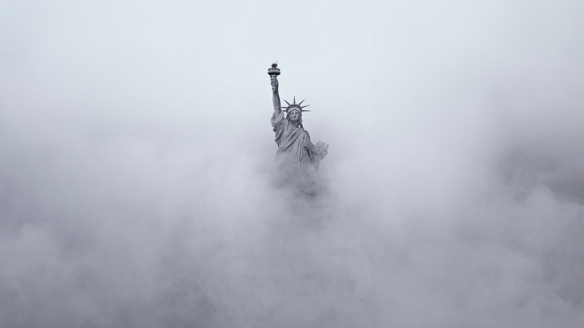 Statue of Liberty emerging from clouds HD Wallpaper