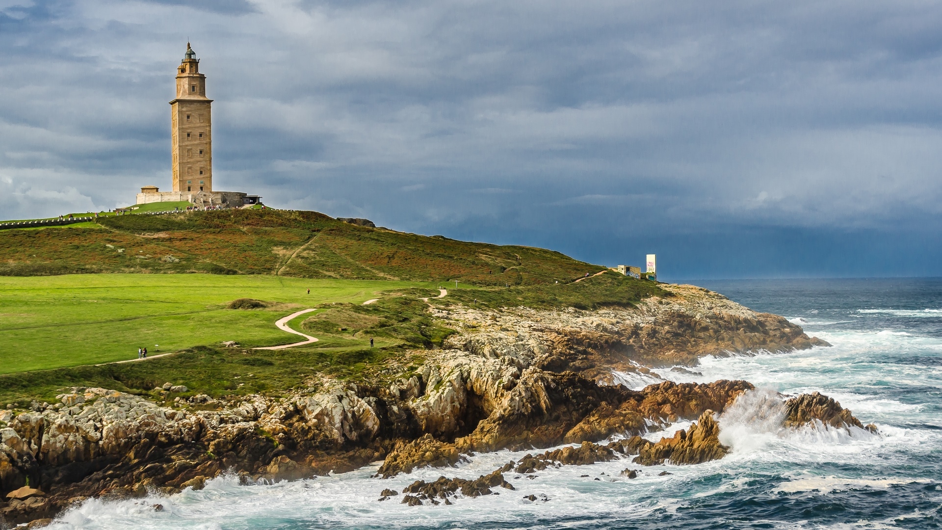 Torre de Hercules lighthouse on a rocky coast in Spain HD Wallpaper