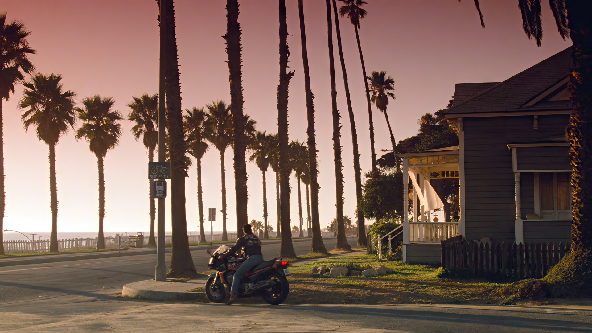 Tom Cruise on a motorcycle in Top Gun HD Wallpaper