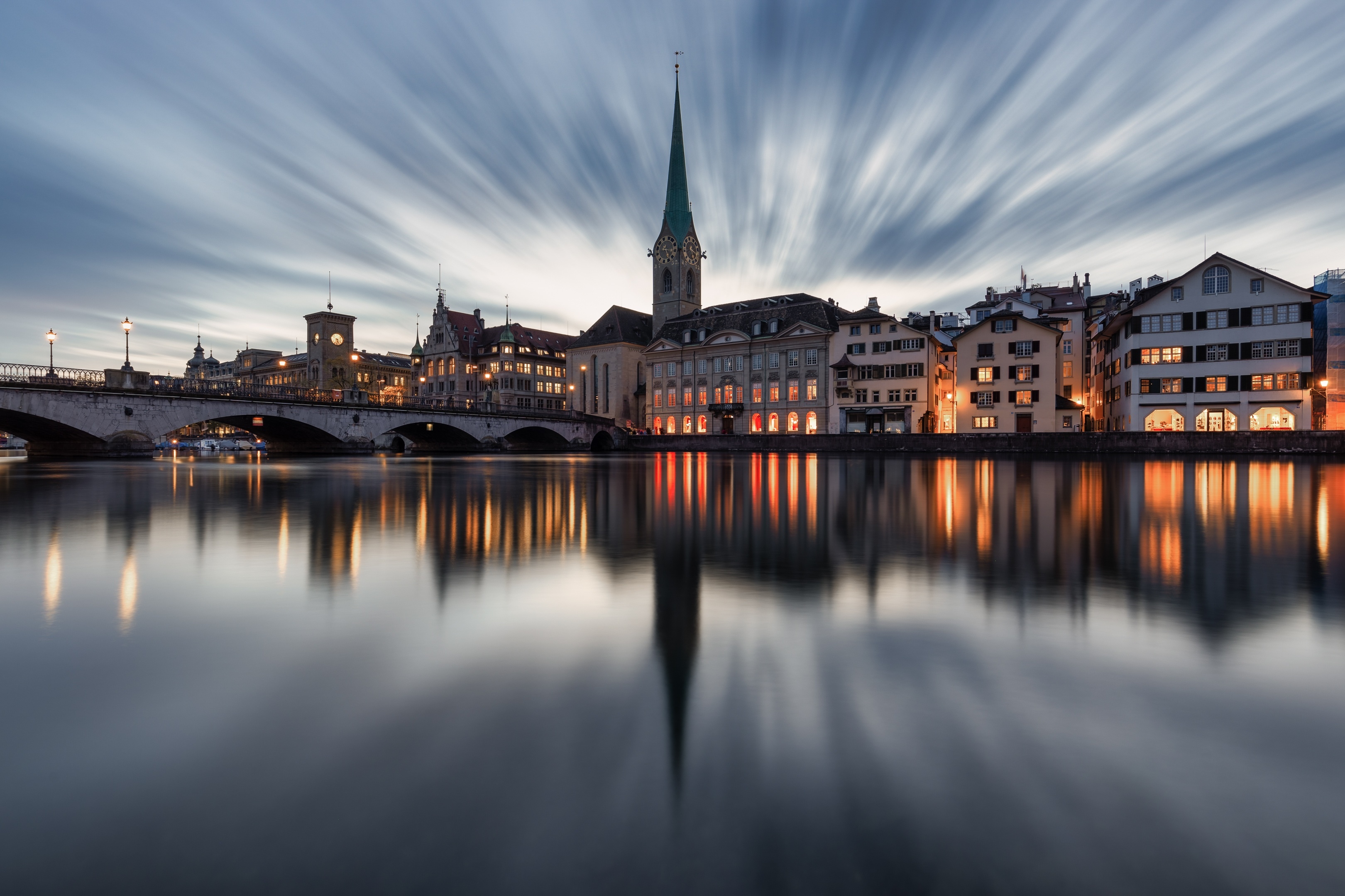 Zurich cityscape with river and long exposure clouds HD Wallpaper