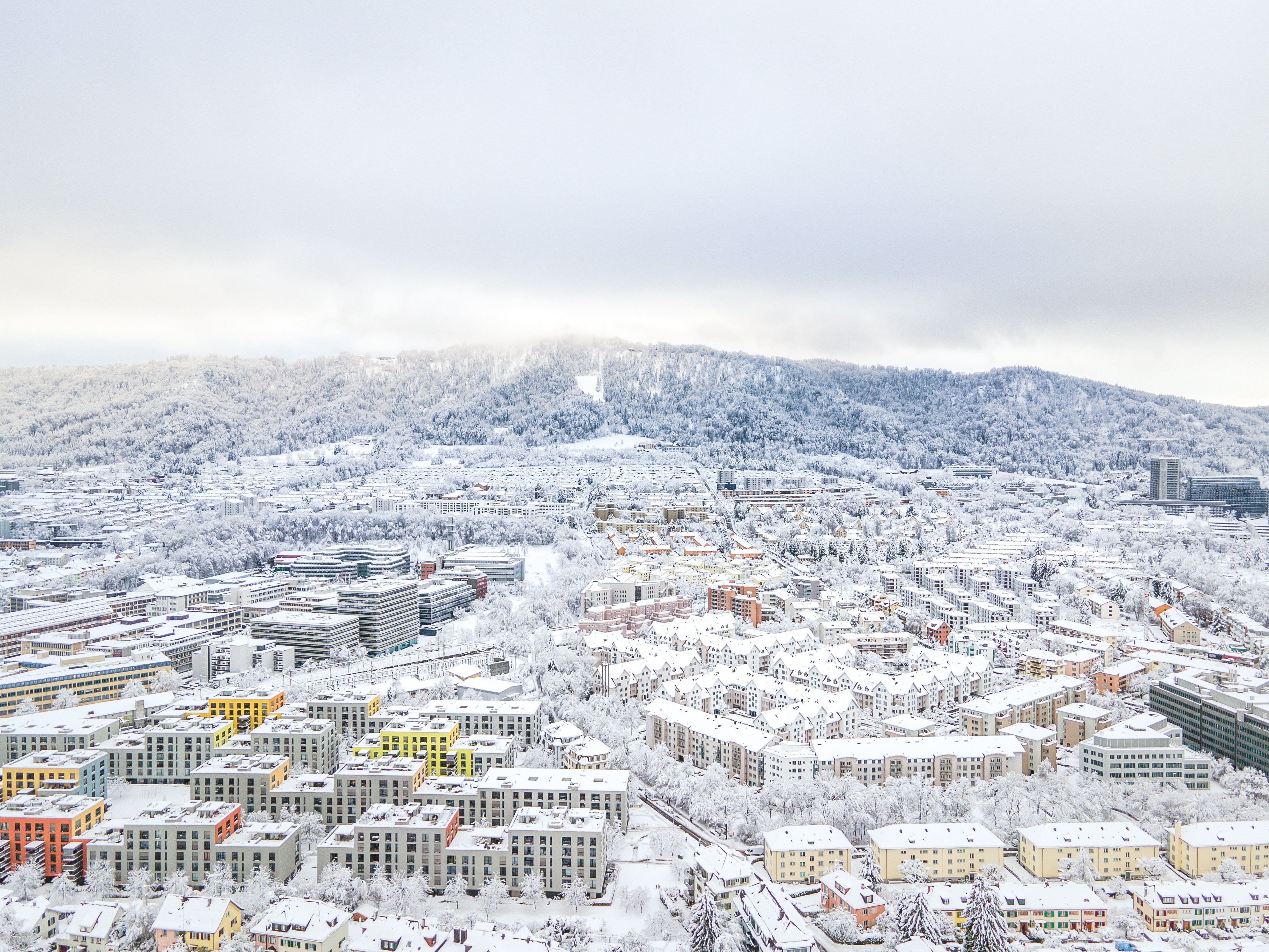 Aerial view of Zurich cityscape covered in snow HD Wallpaper