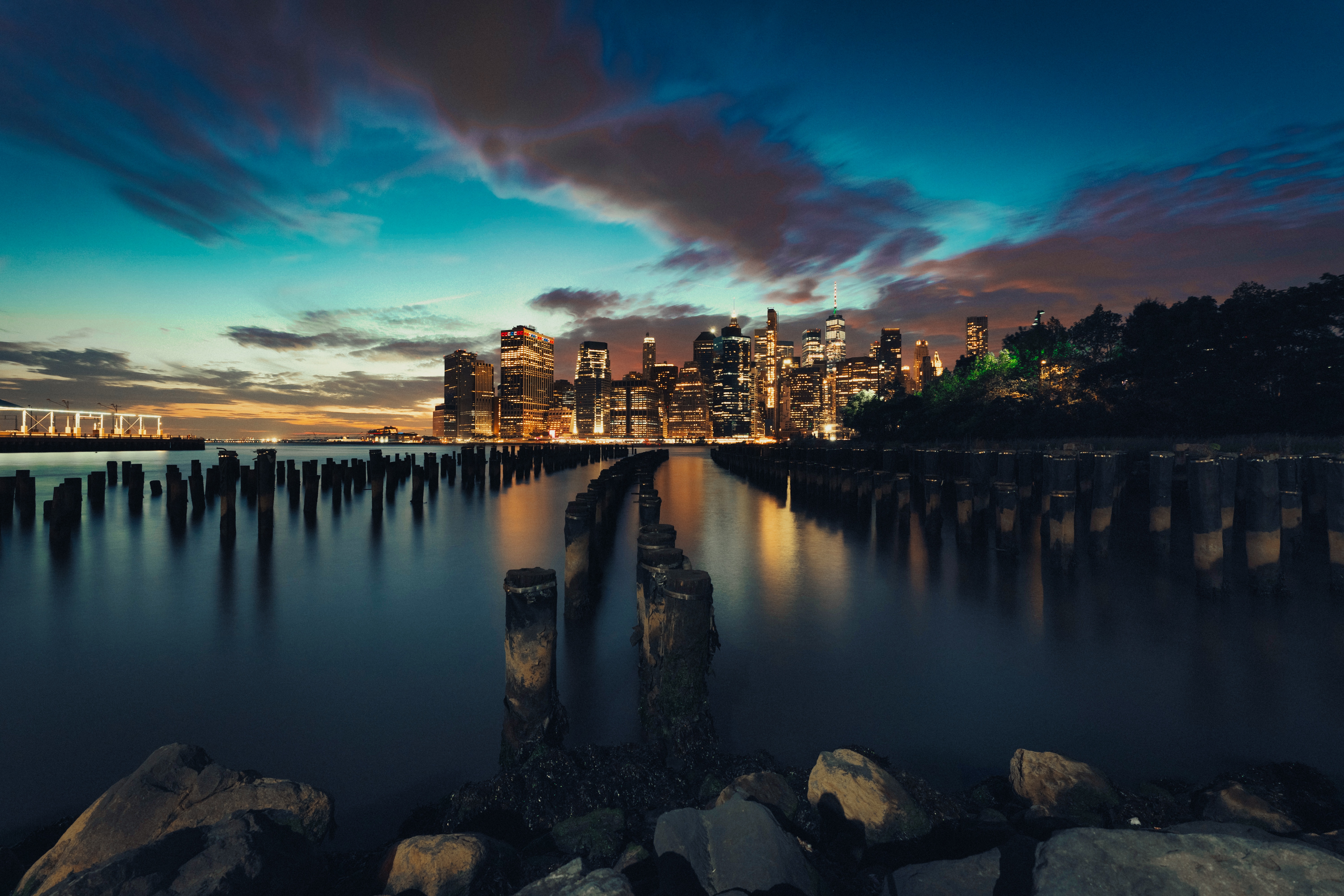 New York City Skyline at Dusk with Pier Pilings HD Wallpaper